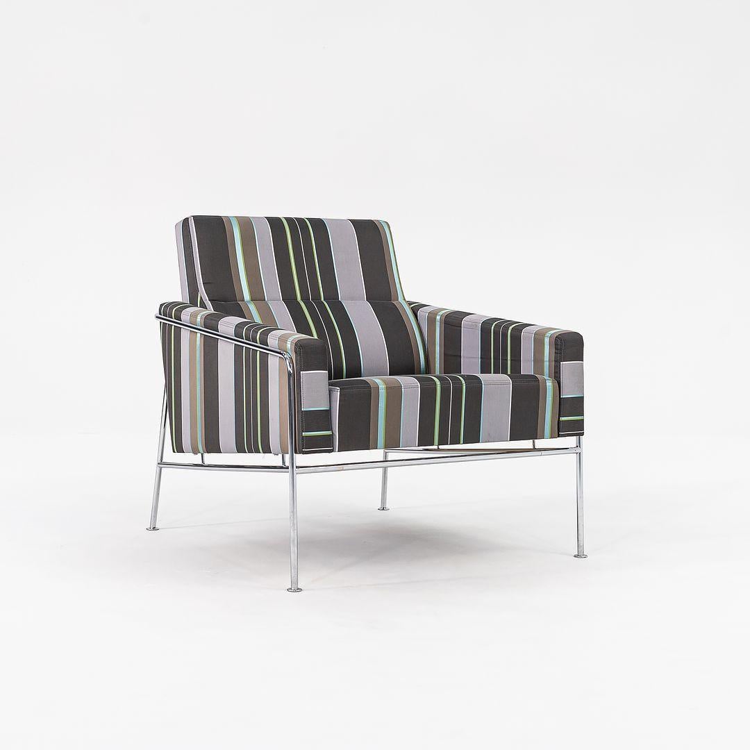 This is Series 3300 Easy Chair, originally designed by Arne Jacobsen for the SAS Air Terminal in Copenhagen in 1958. The listed price includes one chair, and we have 2 chairs available in this fabric. These examples were produced by Fritz Hansen in