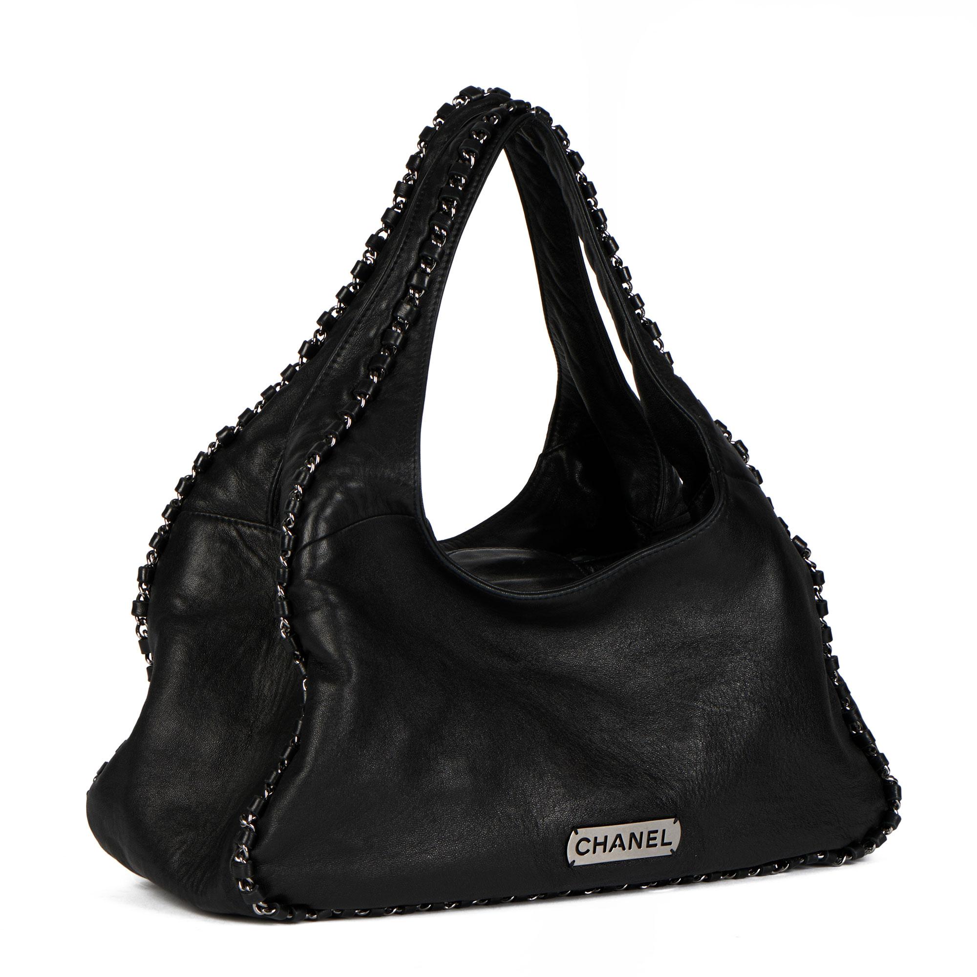 CHANEL
Black Goatskin Chain Around Hobo Bag

Serial Number: 9076967
Age (Circa): 2005
Authenticity Details: Serial Sticker (Made in France)
Gender: Ladies
Type: Shoulder, Tote

Colour: Black
Hardware: Silver
Material(s): Goatskin Leather
Interior:
