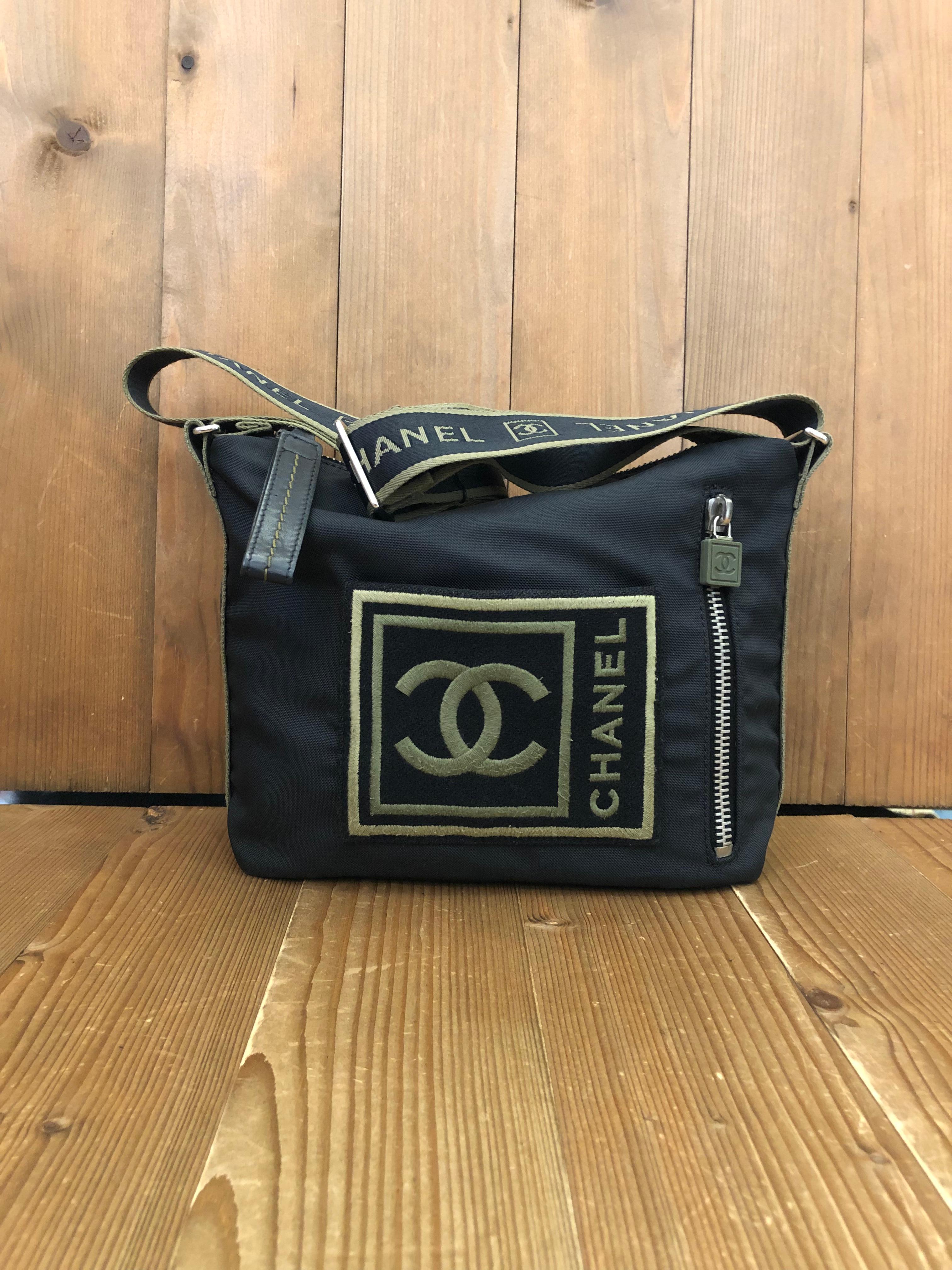 This Chanel sports messenger bag is crafted of black nylon with green embroidered CC front zippered pocket. Top zipper closure opens to a green nylon interior with one zippered pocket. The adjustable strap allows you to carry it on the shoulder or