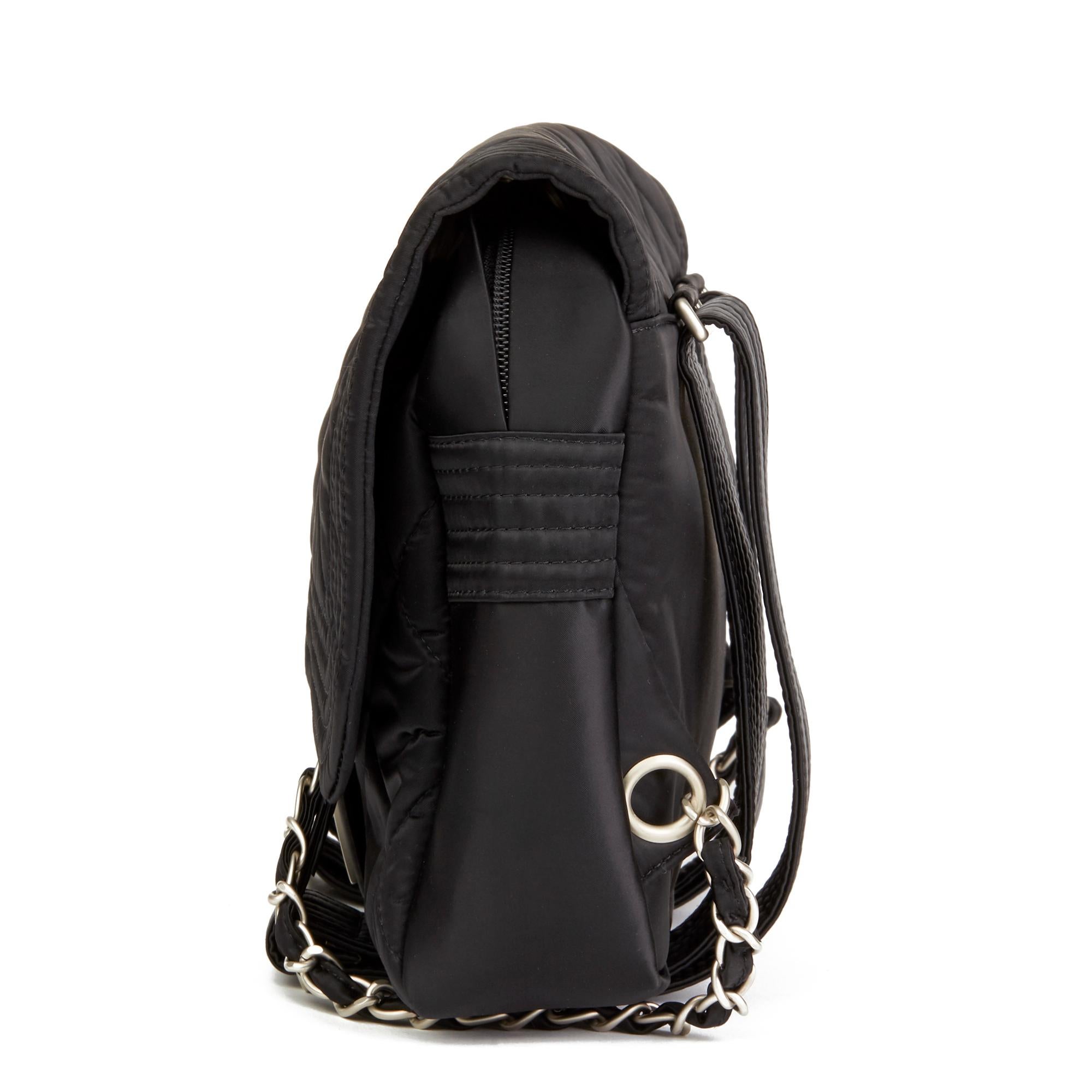 CHANEL
Black Quilted Nylon Sports Line Backpack

Reference: HB2477
Serial Number: 10307123
Age (Circa): 2005
Authenticity Details: Serial Sticker (Made in Italy)
Gender: Ladies
Type: Backpack 

Colour: Black
Hardware: Matte Silver
Material(s):