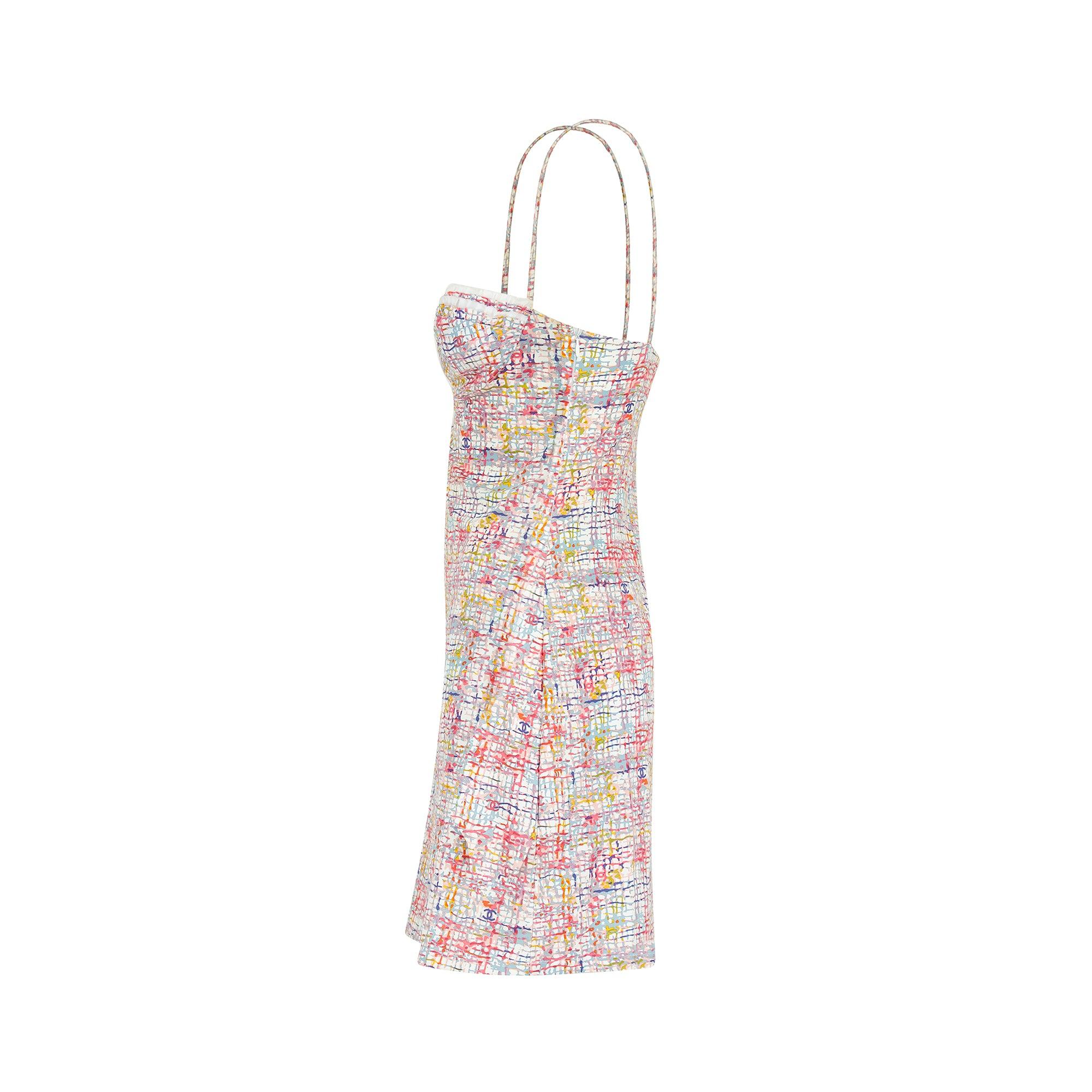 Reminiscent of 90's designs this dress is from Chanel’s 2005 Cruise collection. It would be hard to find a more iconic summer mini dress from the brand. Thin, elasticated spaghetti straps hold up a balconette top that is underwired, creating a