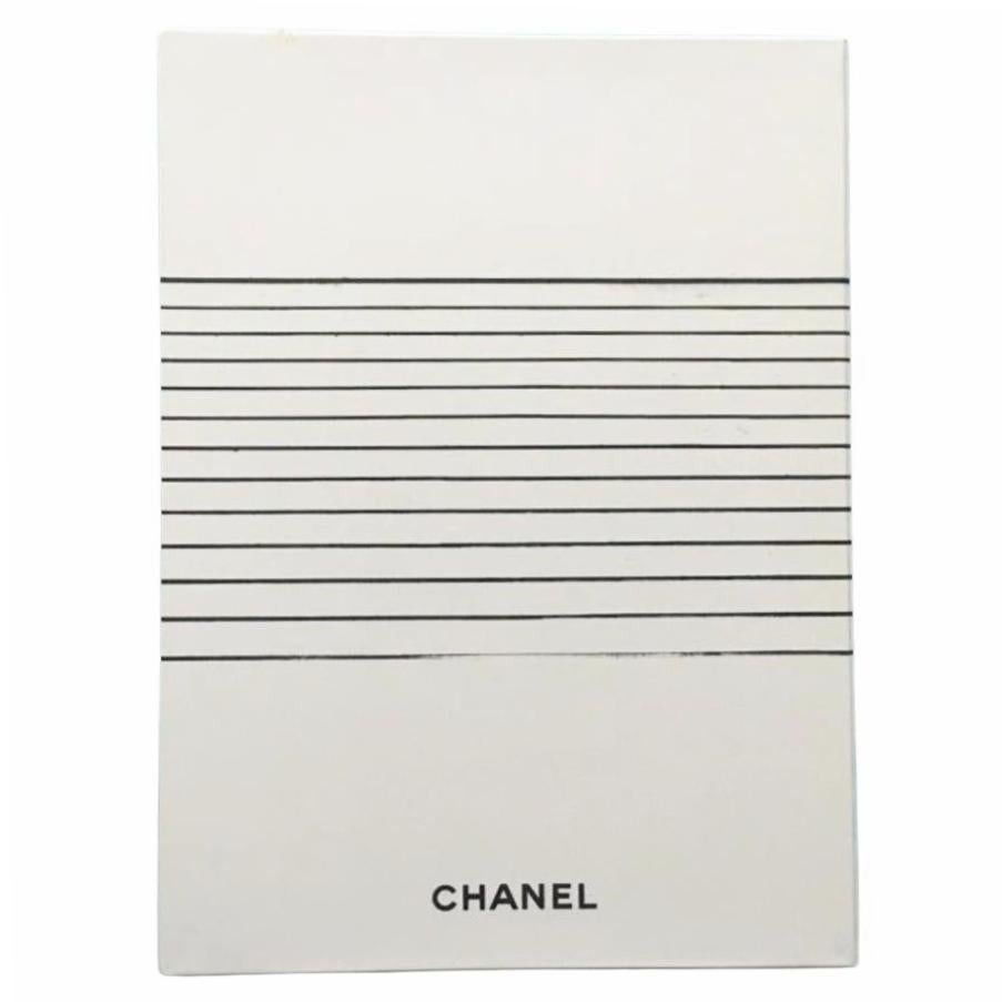 Step into the refined fantasy of the Chanel Spring/Summer 2005 collection with this rare runway catalogue, an authentic piece of fashion history. Shot under the creative direction of Karl Lagerfeld, this season reimagined effortless luxury with