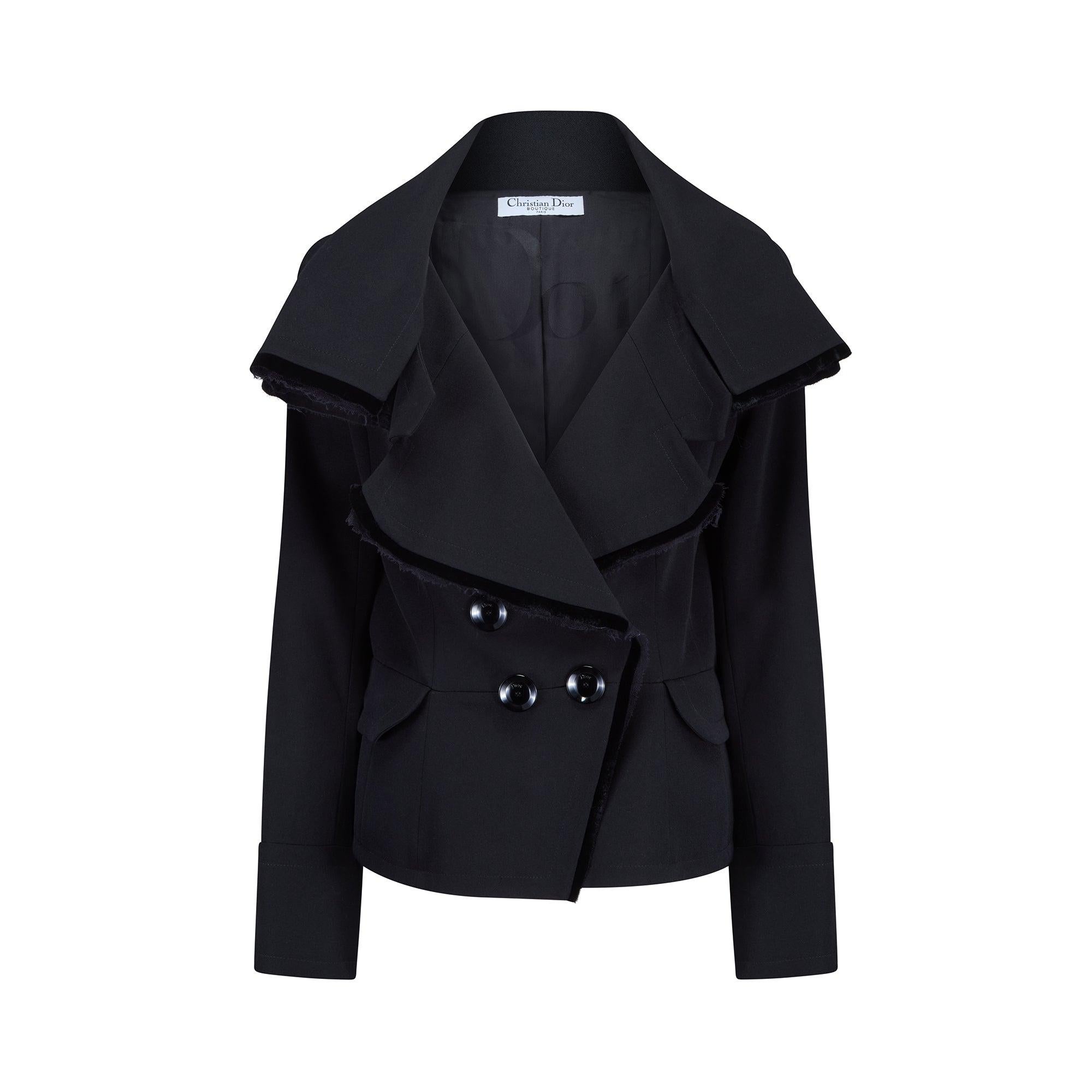 This 2005 Fall collection Christian Dior black coat was designed by John Galliano during his lauded tenure as Creative Director. Pristinely tailored from thick jet black wool which is stiff enough to hold its shape, it has a double-breasted cut