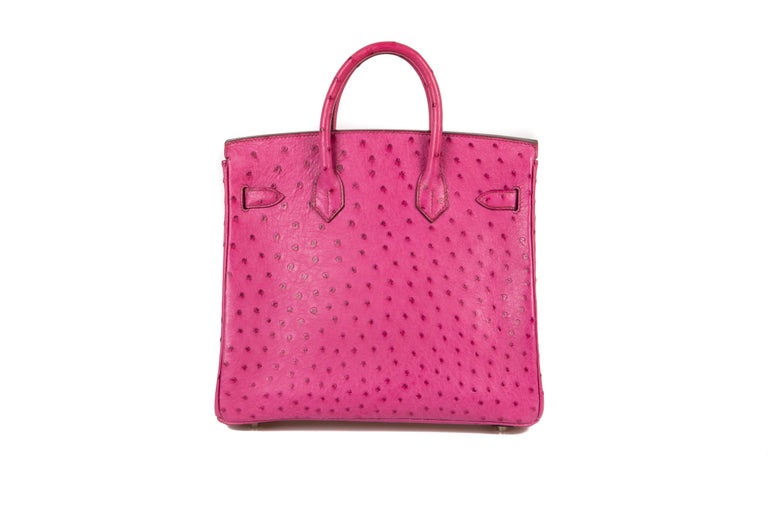 A rare, collectable and highly sought-after 21st century (2005) Hermès fuchsia pink ostrich Birkin 28, comprising of one compartment with one self-toggle gusseted zipper pocket and one patch pocket, fully lined in rose pink leather, suspended on a