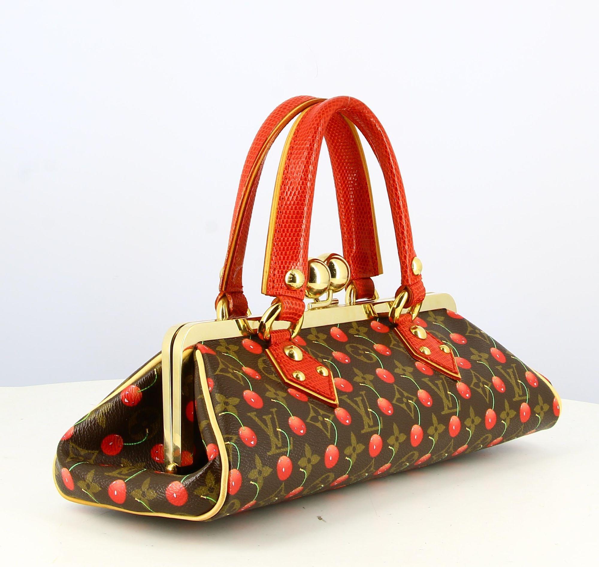 2005 Louis Vuitton Lizard Cherry Monogram Handbag

- Good condition. Shows slight signs of wear over time
- Louis Vuitton cherry monogram handbag
- Small red crocodile leather strap
- Golden clasp
- Inside: red suede + small pocket
- Packaging :