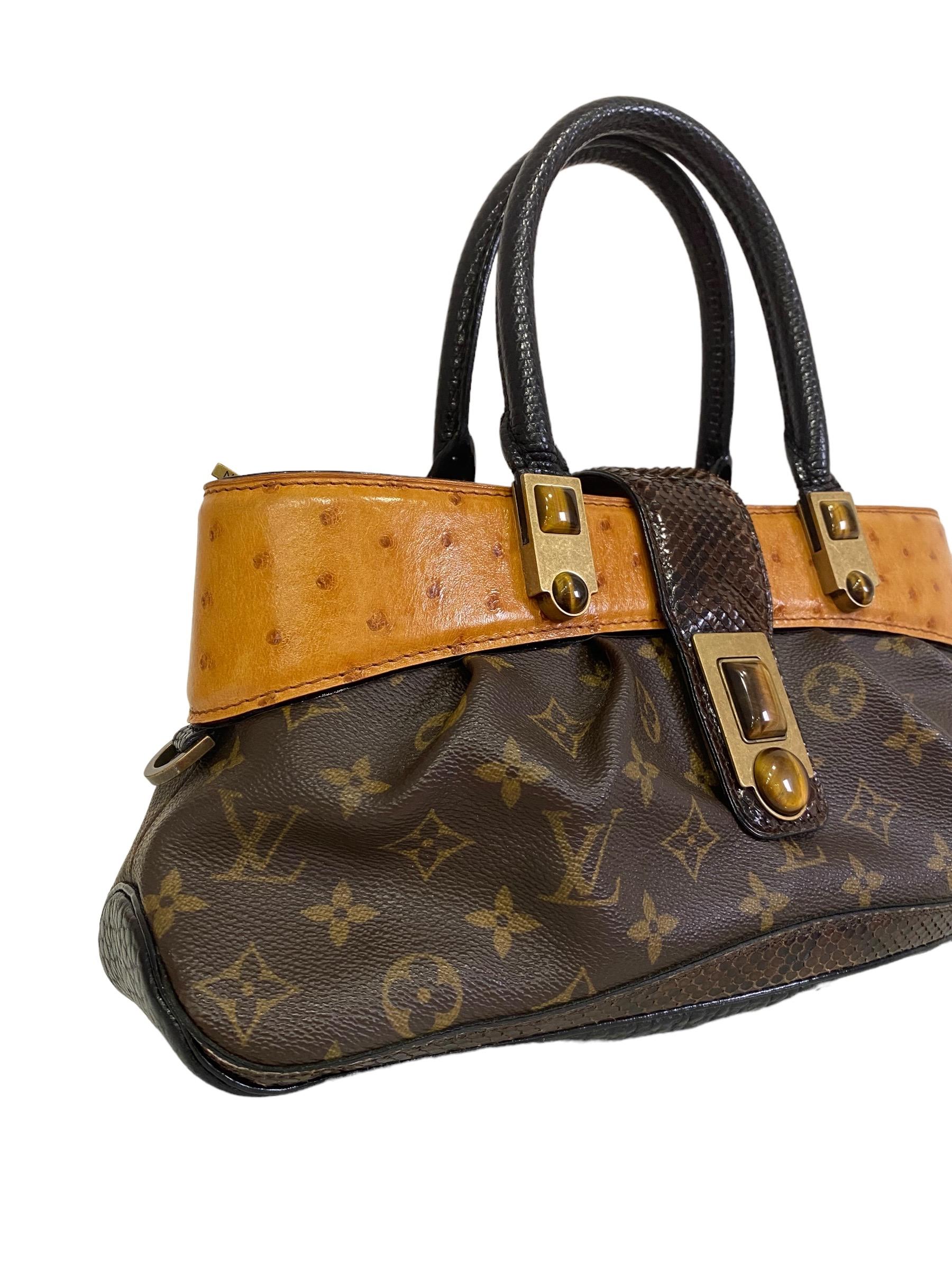 Louis Vuitton signed bag limited edition autumn/winter 2005 Tigereye in collaboration with Marc Jacobs

Combined with precious exotic leathers: ostrich, python and lizard.

Opening adorned with semi-precious tiger’s eye cabochons with brushed