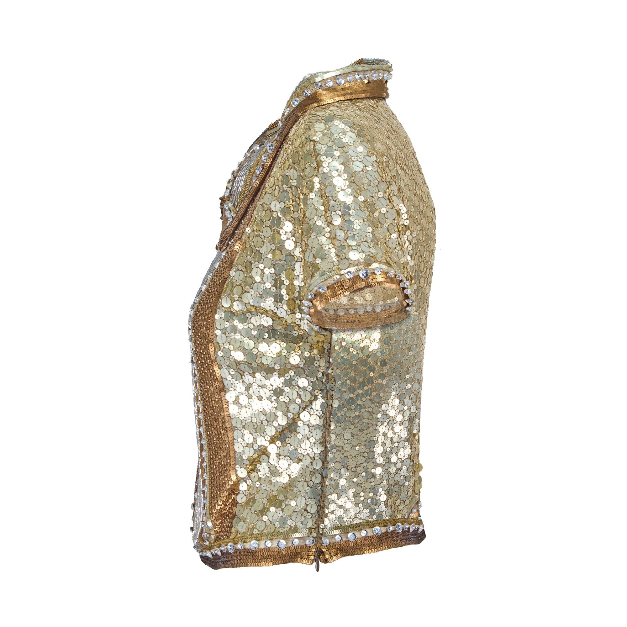 This mesmerising gold sequin top walked the runway as look 63/75 for Valentino’s Spring 2005 show. Vogue wrote that this collection, “drew inspiration from a woman who travels the world, hitting the global trail with a few hippie looks and some