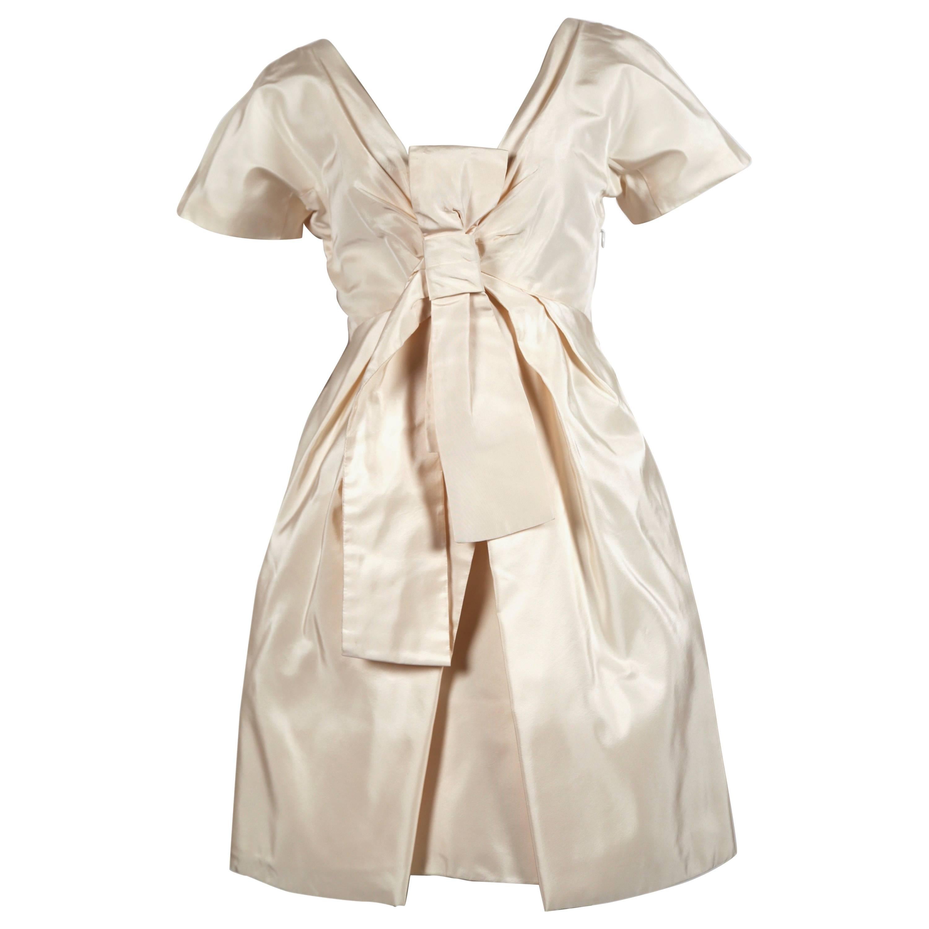 2006 ALEXANDER MCQUEEN cream silk runway dress with bow detail