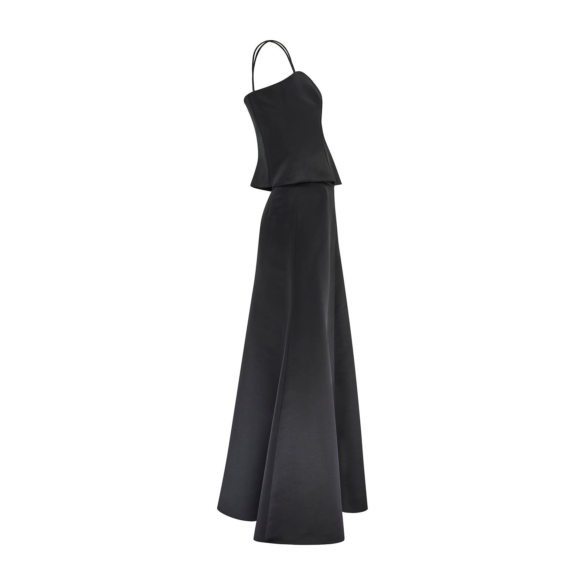 This graceful black evening ensemble was designed by Giorgio Armani in 2006 for his high-end ready to wear Collezioni line which has since been absorbed back into the mainline runway collection. Drawing on Armani house signatures of polished evening