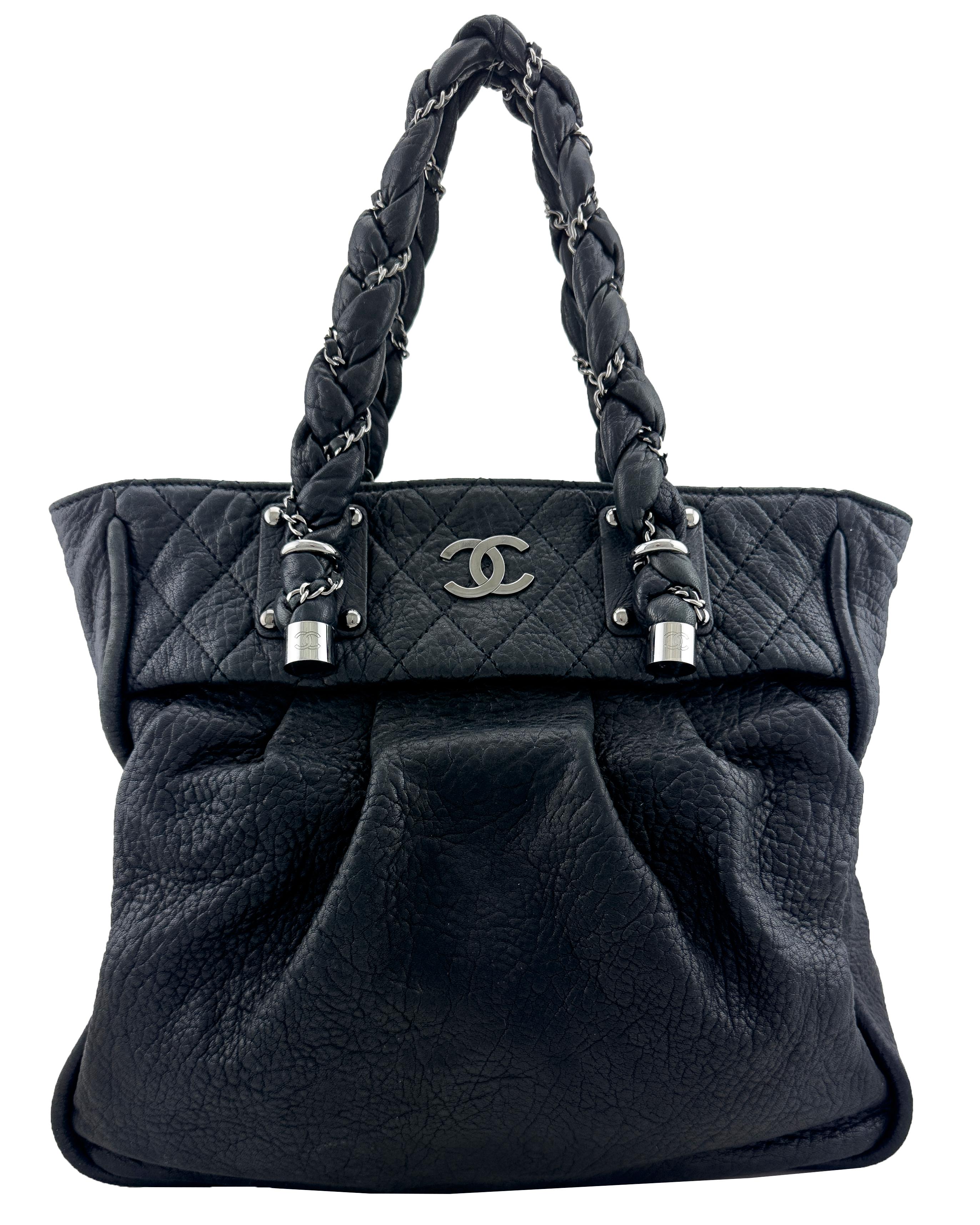 2006 Lady Braid Tote by Karl Lagerfeld from one of Chanel’s most coveted early-2000s collections. Large and crafted from unstructured distressed black leather with contrasting silver metal hardware. Top stitched quilting on the top quarter of the