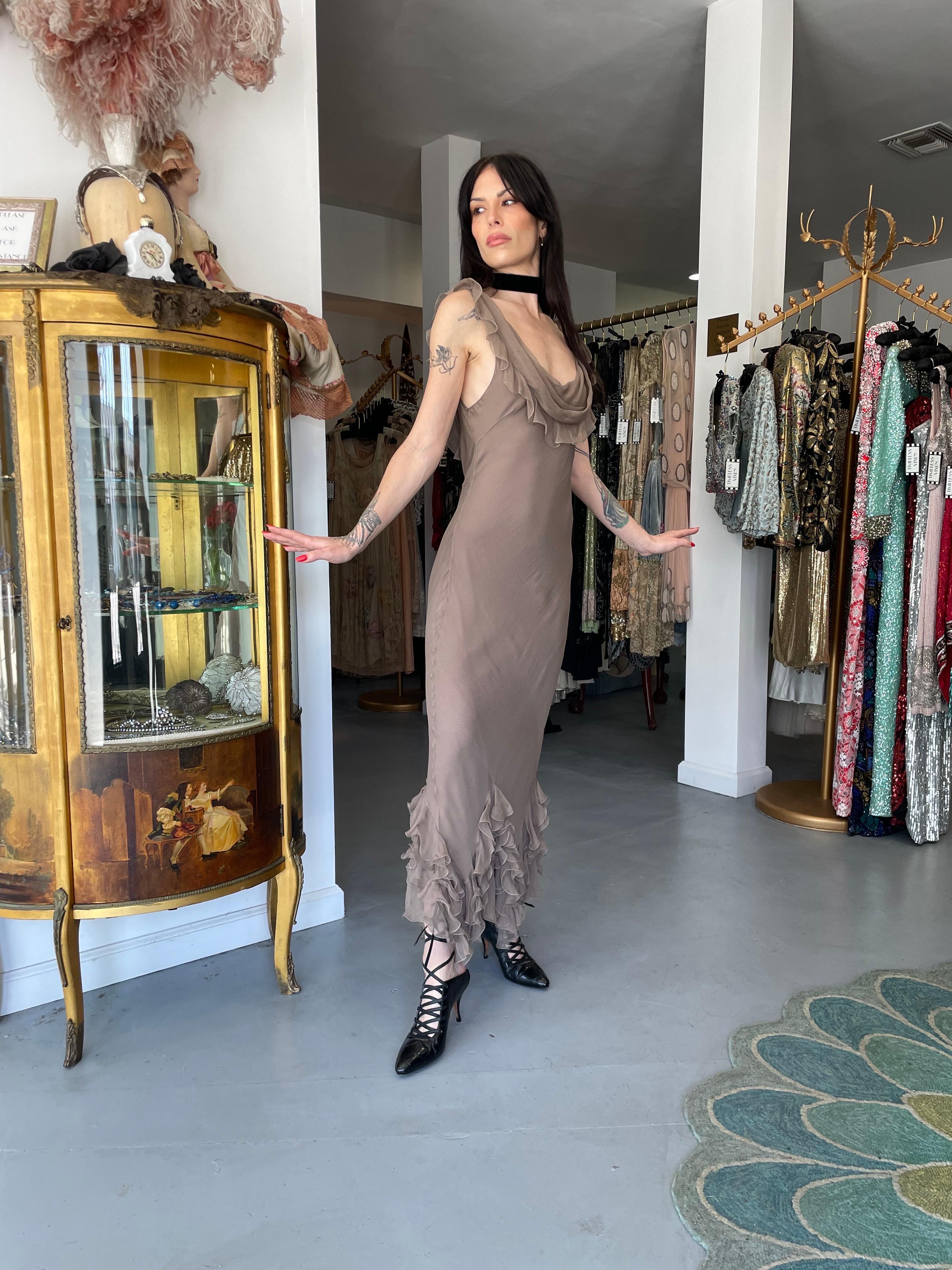 An absolutely breathtaking and highly coveted Christian Dior smoky taupe silk chiffon bias-cut gown dating back to John Galliano's epic 2006 spring/summer collection. John Galliano is widely considered one of the most innovative and influential