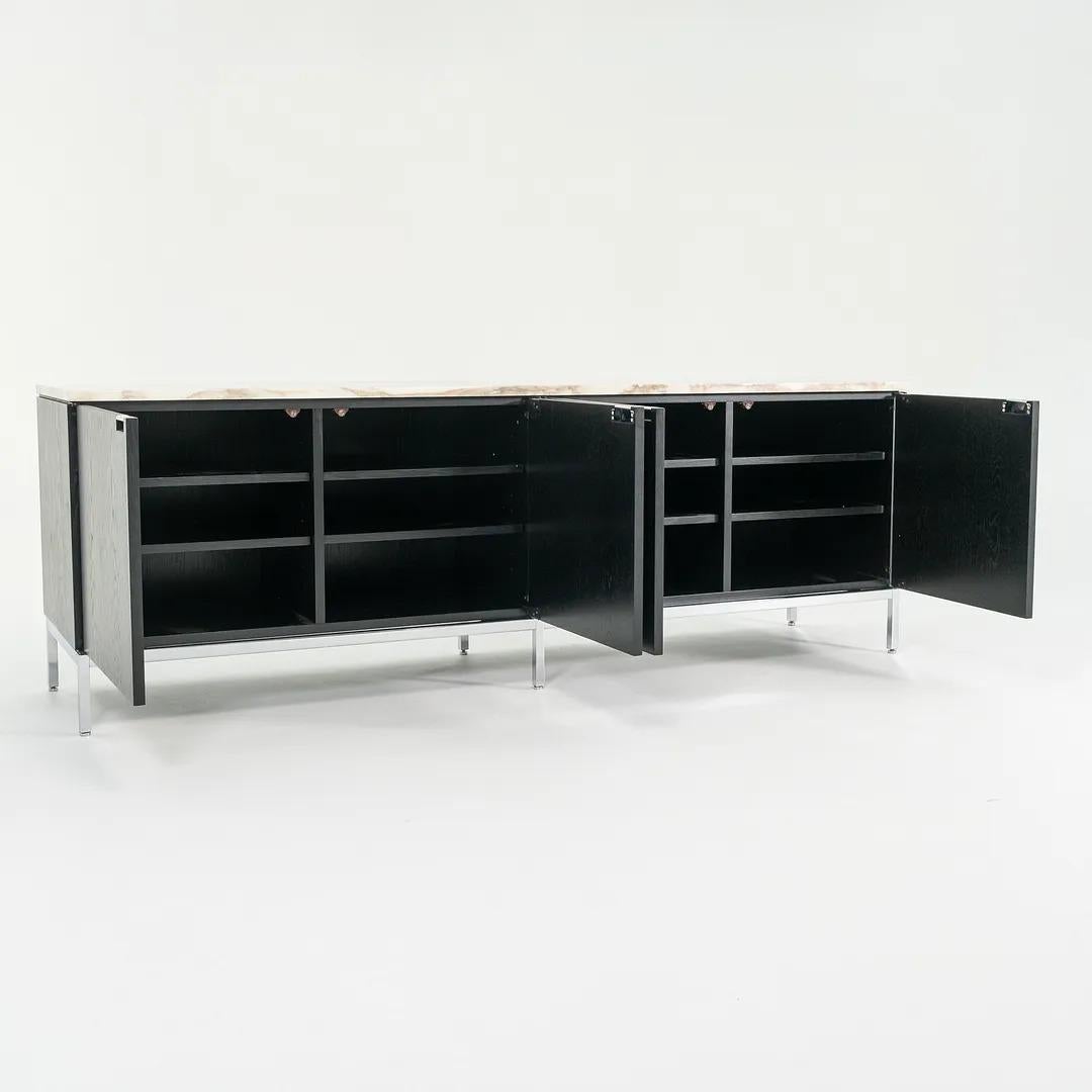 This is a '4-Position' Credenza, model 2544, initially designed by Florence Knoll in 1961. This particular example dates to 2006. The piece is constructed of rich ebonized oak, and features a Calacatta marble top. The lines of this piece have become