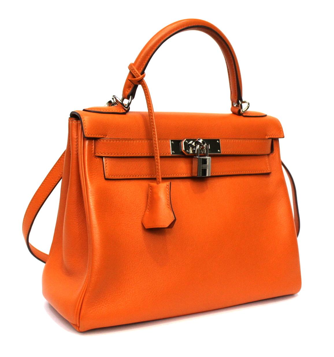 Hermès bag Kelly model 28 made of soft orange leather with silver hardware.

This timeless bag is in excellent condition, equipped with an original dustbag.

year 2006.