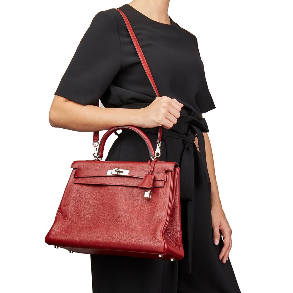 HERMÈS
Rouge H Clemence Leather Kelly 32cm Retourne

Xupes Reference: HB2217
Serial Number: [J]
Age (Circa): 2006
Accompanied By: Hermès Dust Bag, Box, Lock, Keys, Clochette, Shoulder Strap, Care Booklet
Authenticity Details: Date Stamp (Made in