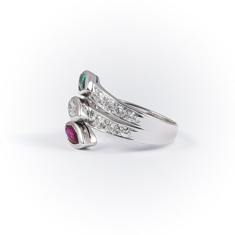 Handmade 2006 Italia white gold 18k ring with 1 ruby navette cut 0.44 carats, 1 emerald navette cut 0.32 carats, 1 diamond navette cut 0.34 carats and 14 diamonds 0.67 carats.