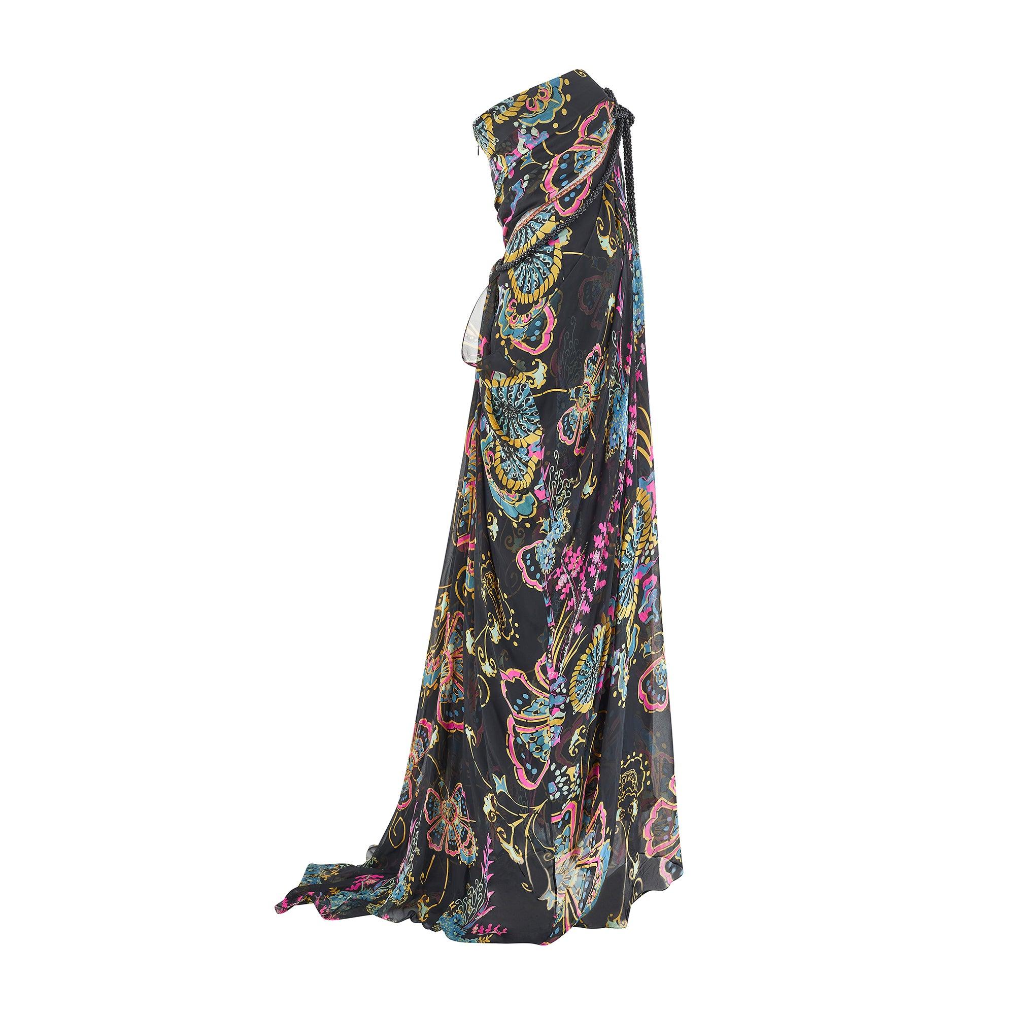 This rare, documented gown was created by French couturier Christian Lacroix. The mini-dress version walked the runway as part of the Fall 2006 show. The silhouette is playful and the fabric unusual - signature traits in the French designer’s