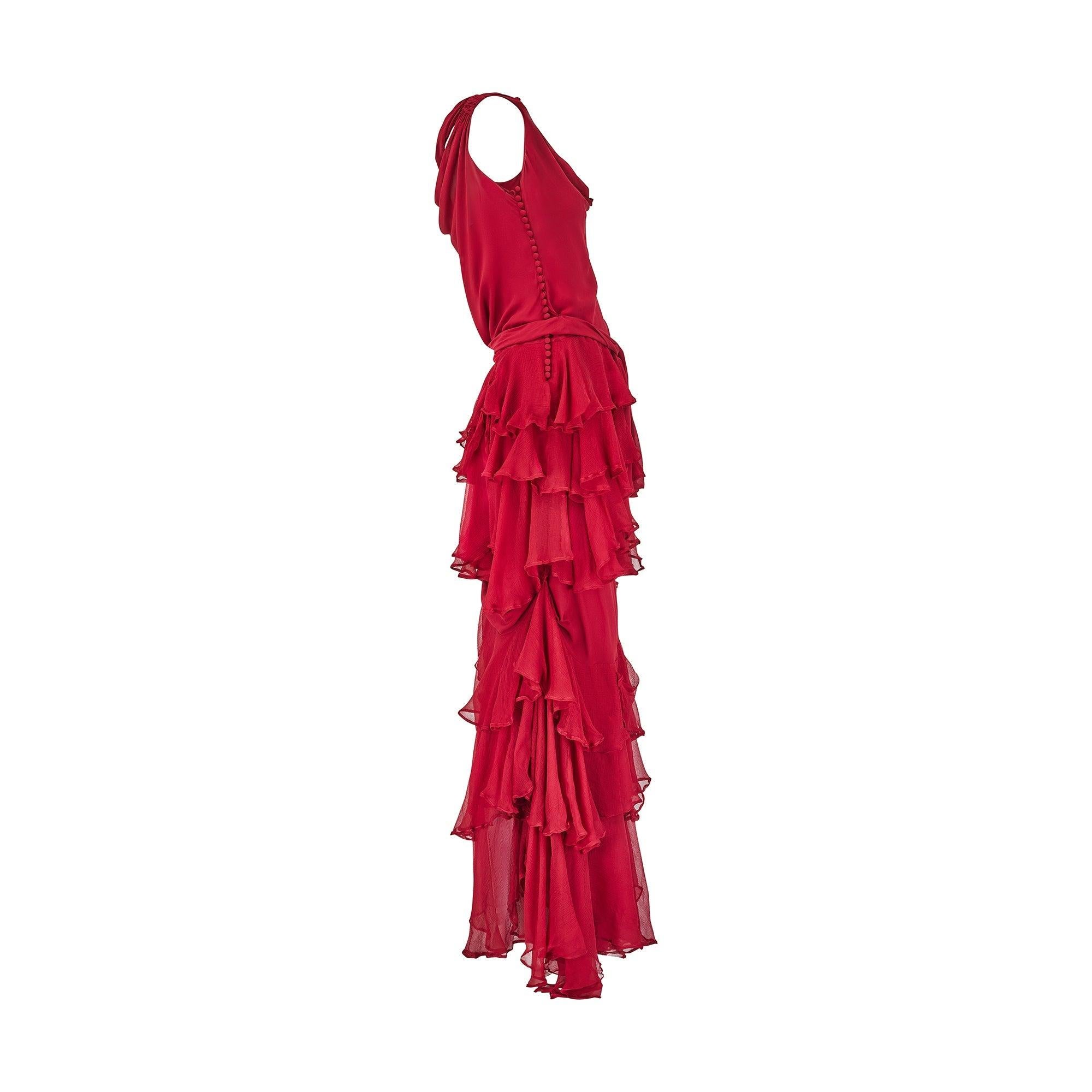 This stunning, floor sweeping dress walked the runway for Christian Dior’s Fall 2006 collection and was Look 43. Created during John Galliano’s heyday at the helm of this inimitable fashion house, this deep red silk gown showcases many of his design
