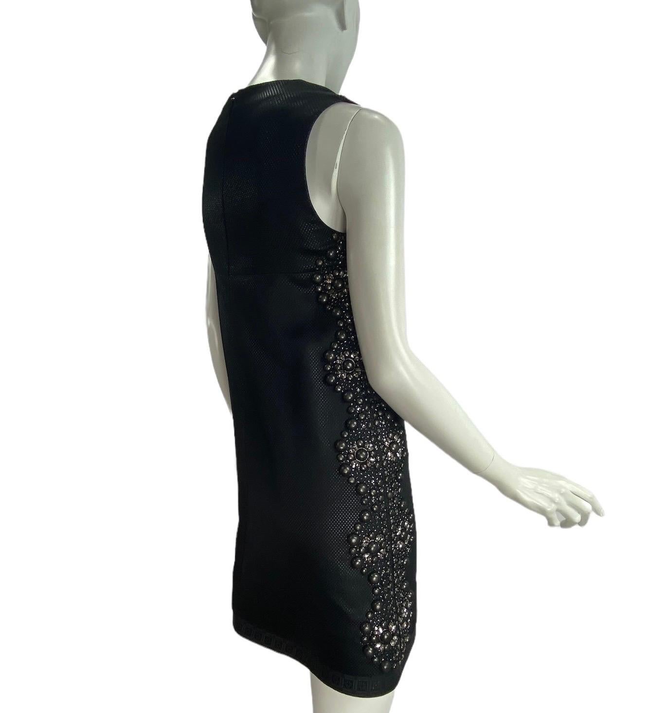2006 Vintage Gucci Studded and Crystal Embellished Black Dress
Italian Size 38 - US 2/4
A-Line Style, Studs covered with tulle, crystals, beads. Fully lined, Sleeveless, Zipper on the back.
Measurements: Bust 32 inches, waist 34