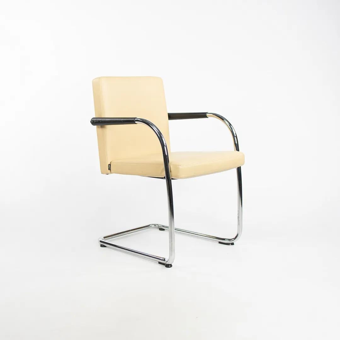 This is a Visasoft stacking armchair (multiple chairs are available, though the price listed is for each chair), designed by Antonio Citterio for Vitra in 2002. The cantilevered frame is formed of chrome-plated tubular steel and its seat retains its
