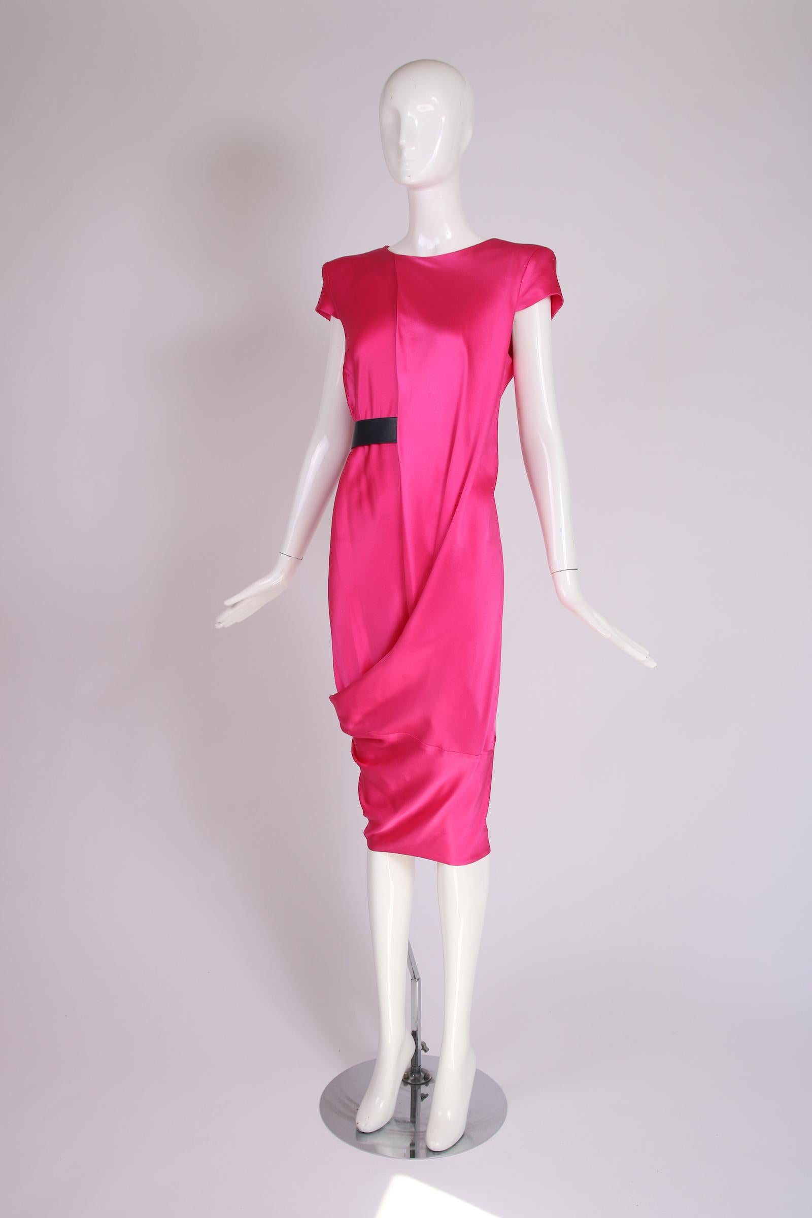 2007 Alexander McQueen pink 100% silk short-sleeved draped asymmetric dress w/hole for belt. Size 44, in very good to excellent condition with some scattered faint marks on the fabric - does NOT come with belt. 

Bust: 36-38