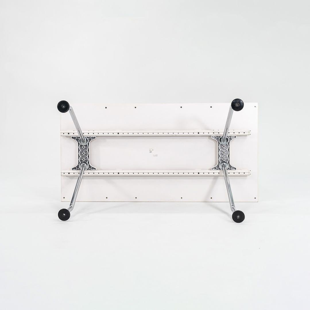 This is an Ad Hoc Desk, designed by Antonio Citterio for Vitra in 1994. The listed price includes one desk, and we have several available for sale. The examples that we have in our inventory date to 2007. The design features a polished cast aluminum