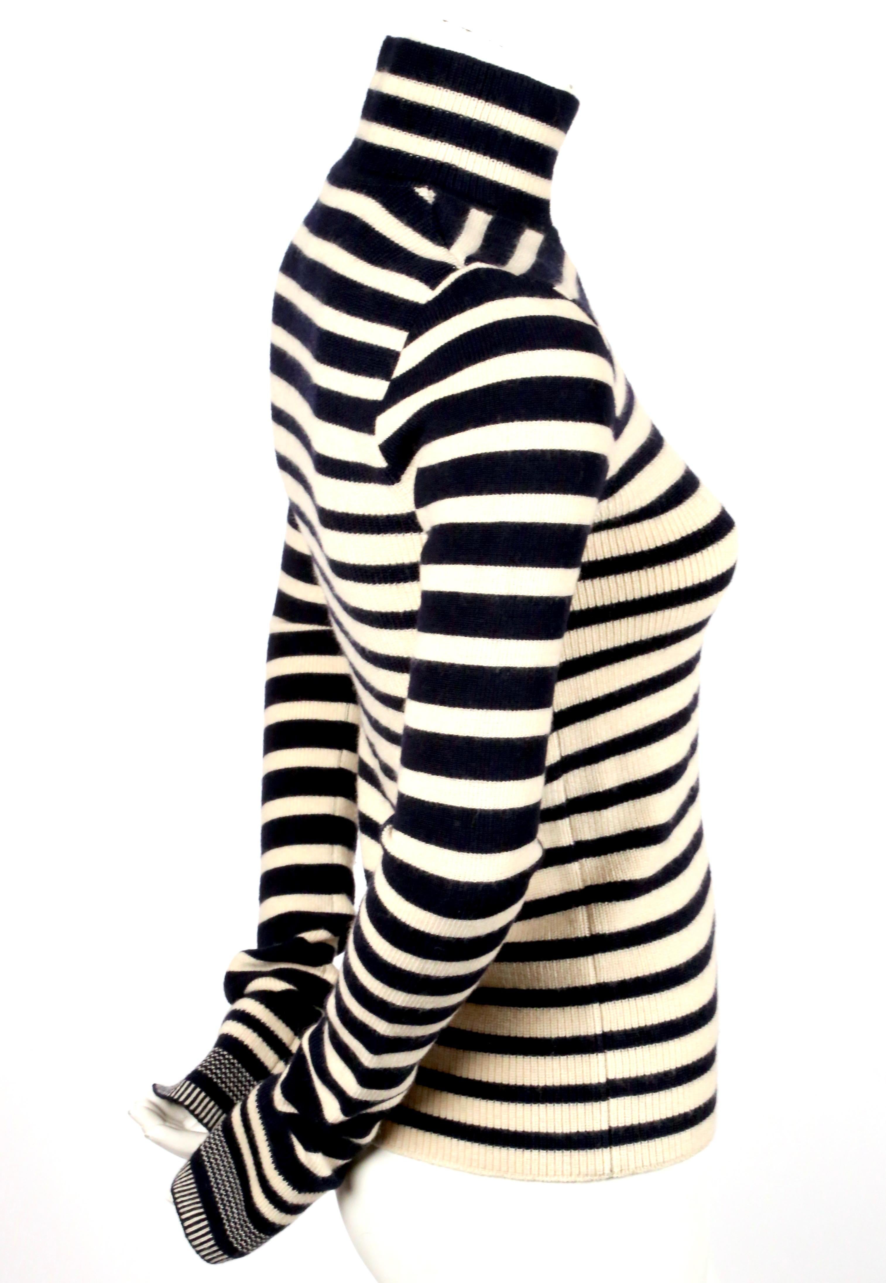 Deepest navy blue and cream striped wool turtleneck sweater with enameled buttons designed by Nicolas Ghesquiere for Balenciaga as seen on the fall 2007 runway. French size 36. Approximate measurements (unstretched): shoulder 13