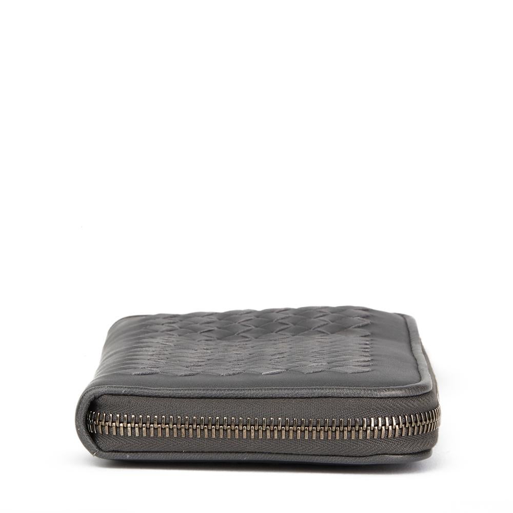 BOTTEGA VENETA
Grey Woven Lambskin Leather Zip Around Wallet

Reference: HB2392
Serial Number: 114076V76951106
Age (Circa): 2007
Accompanied By: Bottega Veneta Box
Authenticity Details: Authenticity Tag (Made in Italy)
Gender: Ladies
Type: