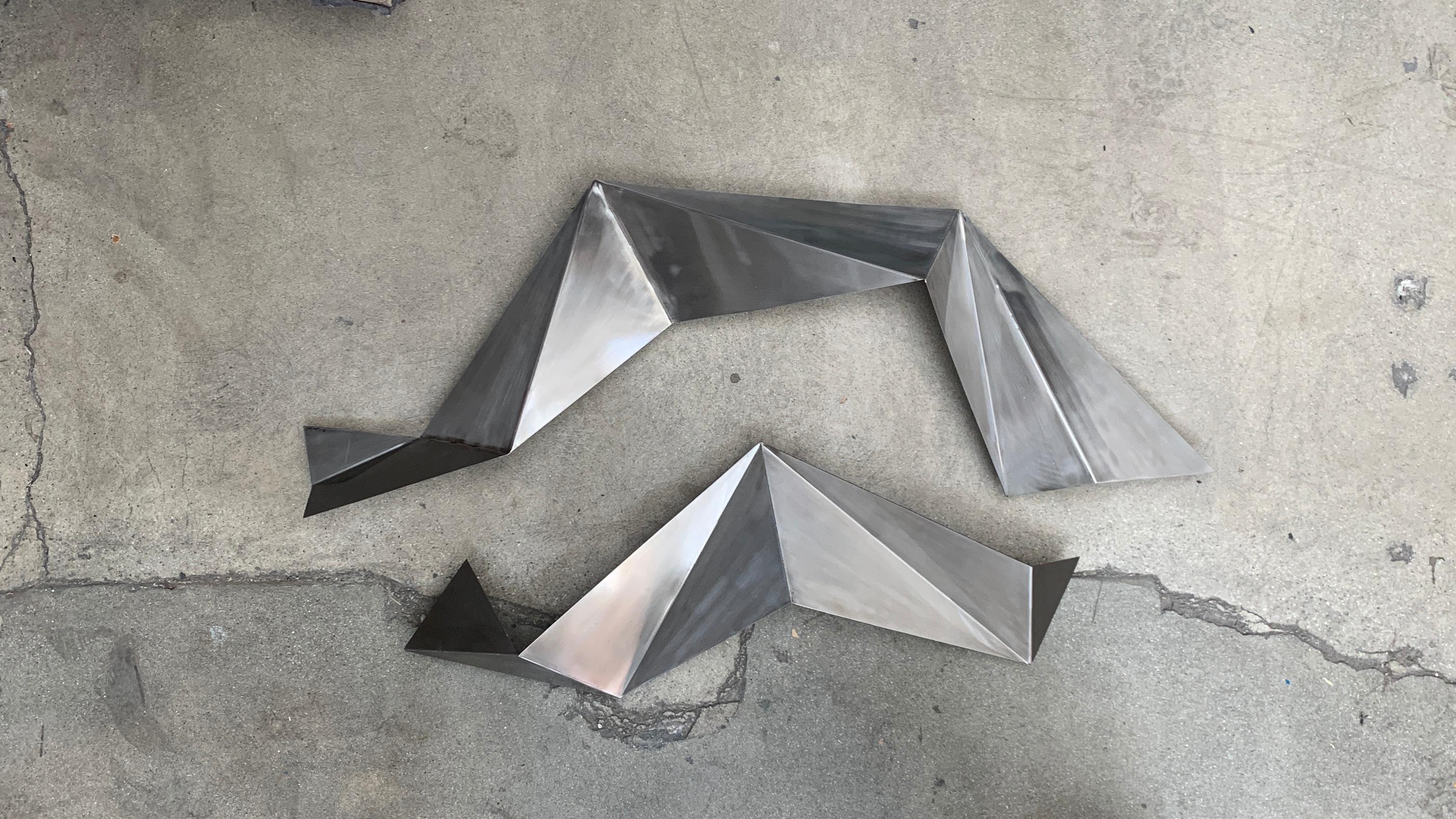 2007 signed Curtis Jere 2 part sculpture in welded steel. Makes a nice geometric shape. Can be hung any way. Each part has three hangers. The metal is sprayed with lacquer. There are some surface scratches and marks. Smaller piece measures 36