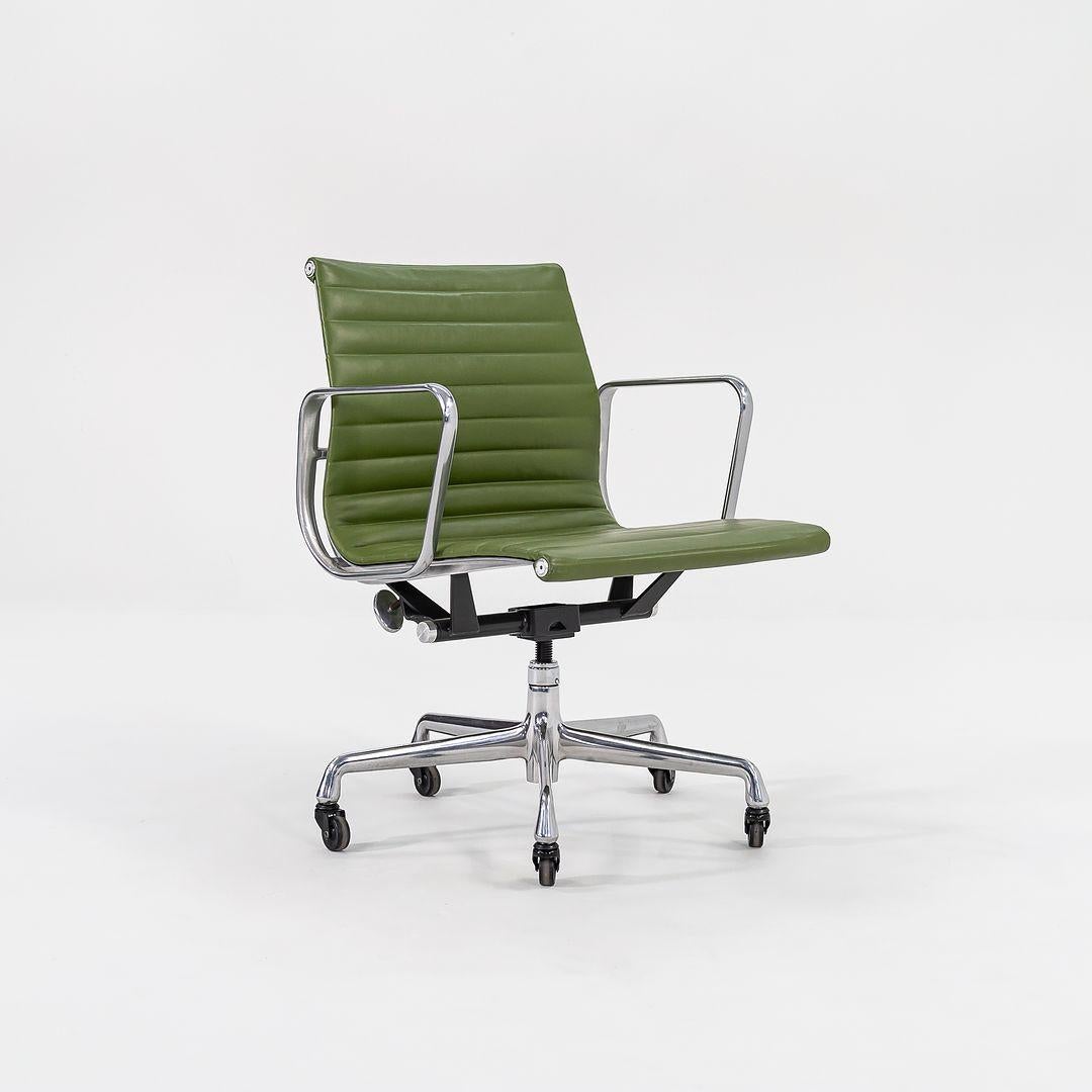 This is an Eames Aluminum Group Management Desk Chair, model EA335, originally designed by Charles and Ray Eames for Herman Miller in 1958. These particular examples date to 2007. The listed price includes one chair, and we have several available