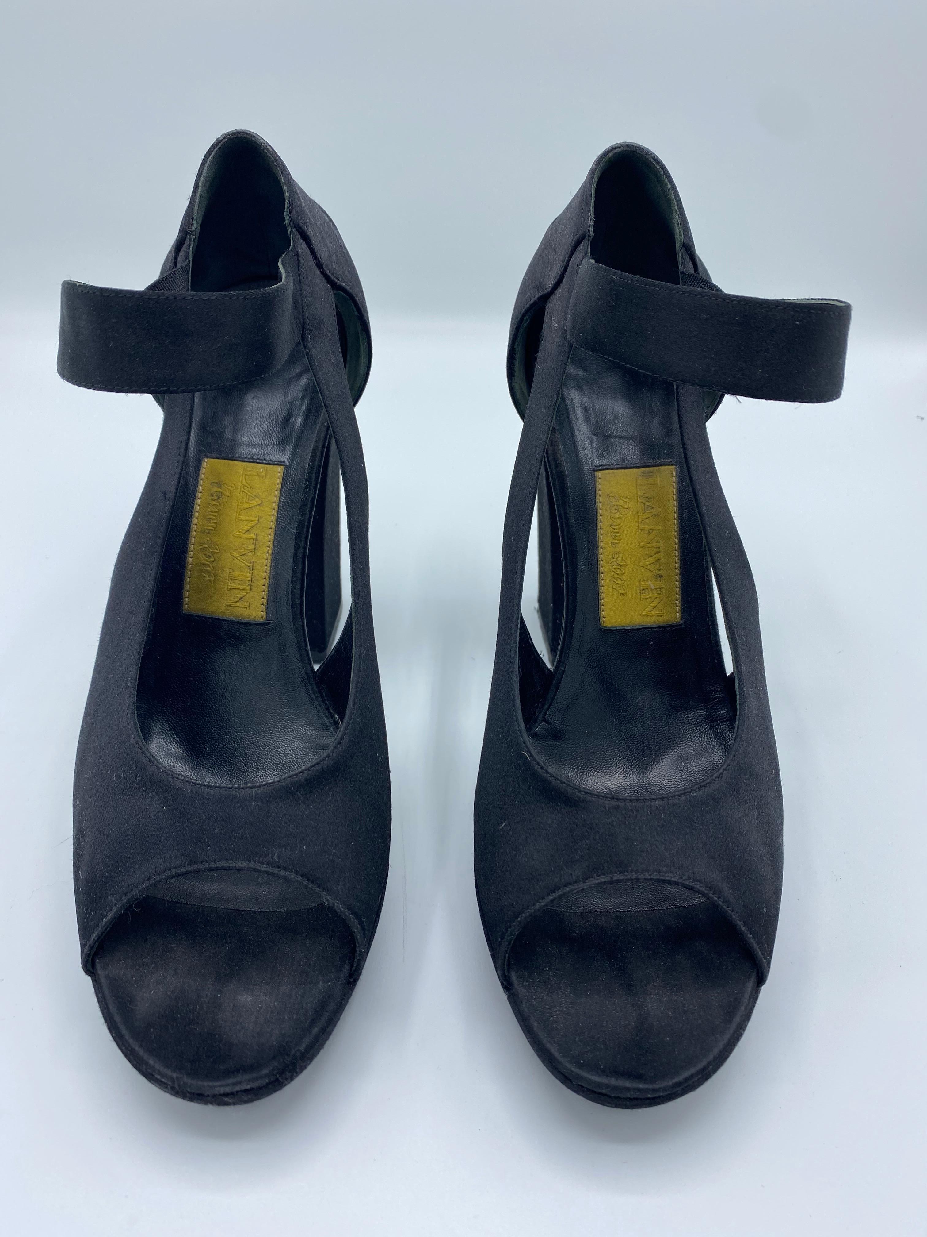 Product details:

The shoes are designed by Lanvin in France, it features open toe, strap with button closure and 4.5 inches heel high.