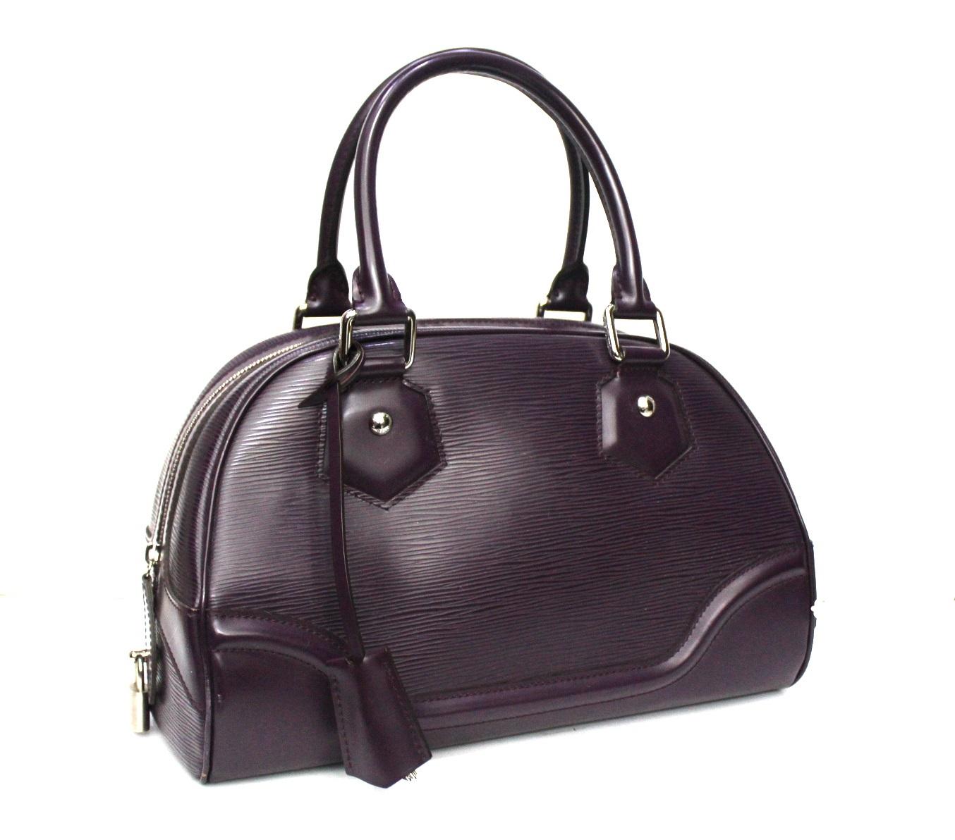 Louis Vuitton Bowling Montaigne bag in purple Epi cloth. Equipped with double leather handle with silver hardware. Zip closure, large enough inside. The bag is in excellent condition. YEAR 2007.