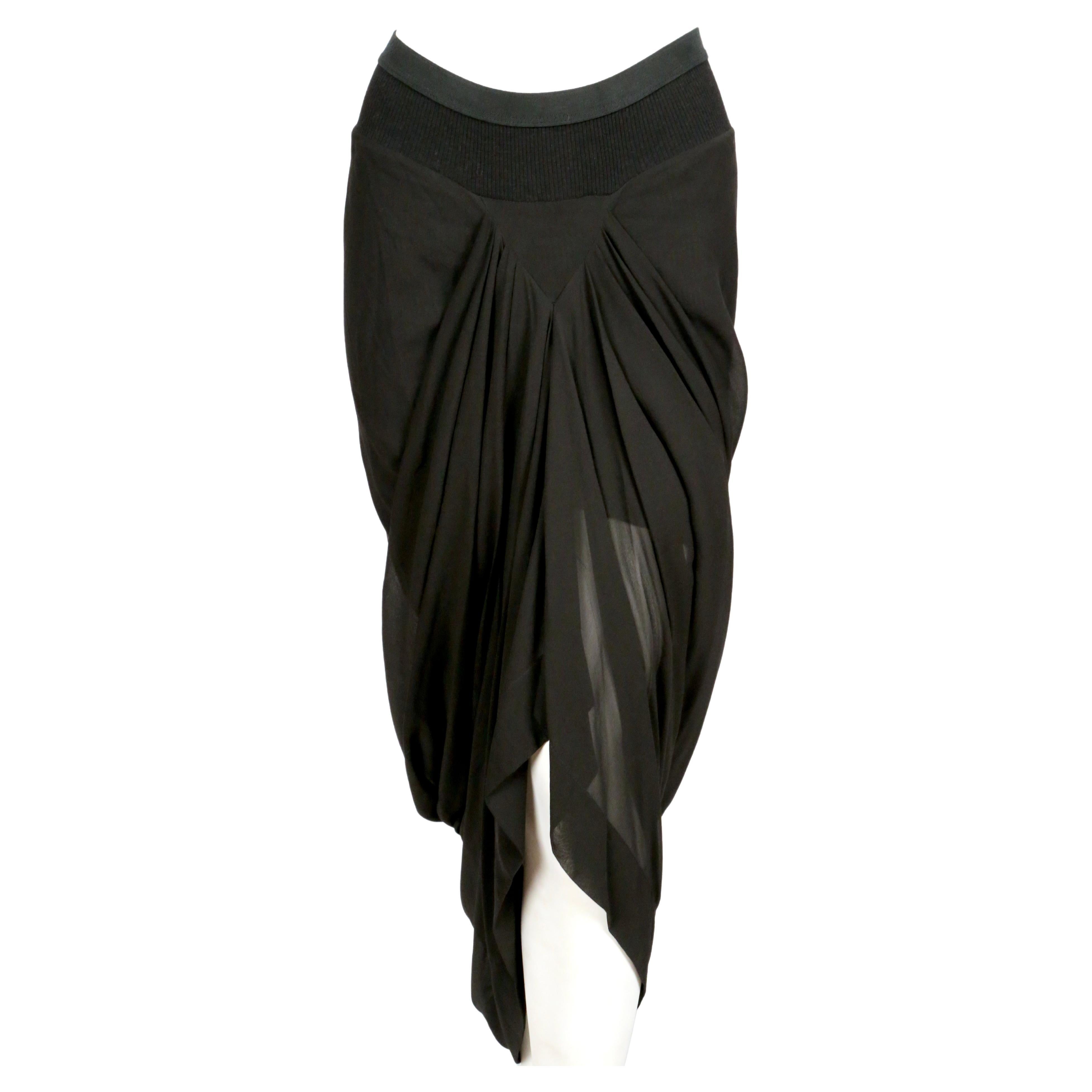 Jet-black, draped silk skirt designed by Rick Owens as seen on the 2007 'wishbone' runway collection. Skirt has a v-shape on the front, draped mermaid-style back and an elasticized waist . Italian size 42 although it fits several sizes due to the