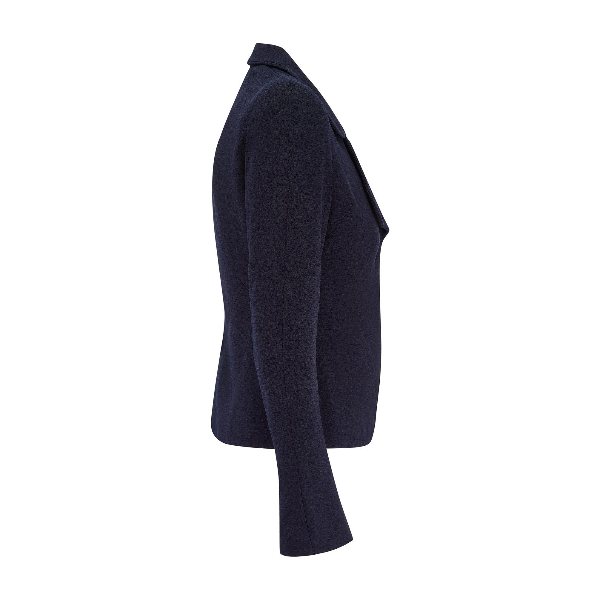 This elegant Alexander McQueen jacket is from the late designer's 2008 collection and was designed by his hand. Note the subtle hint of gothicism and the cerebral draping of the deep navy wool. The jacket features the ingenious tailoring that the