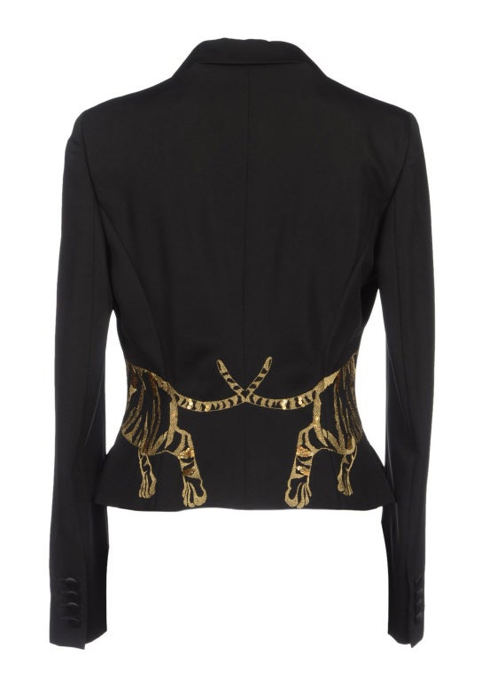 ALEXANDER MCQUEEN EMBROIDERED BLAZER

2008 Collection

52% Viscose, 48% Virgin Wool
Gold tiger embroidery is finished with sequins.

Fully lined

Size 38

Excellent condition