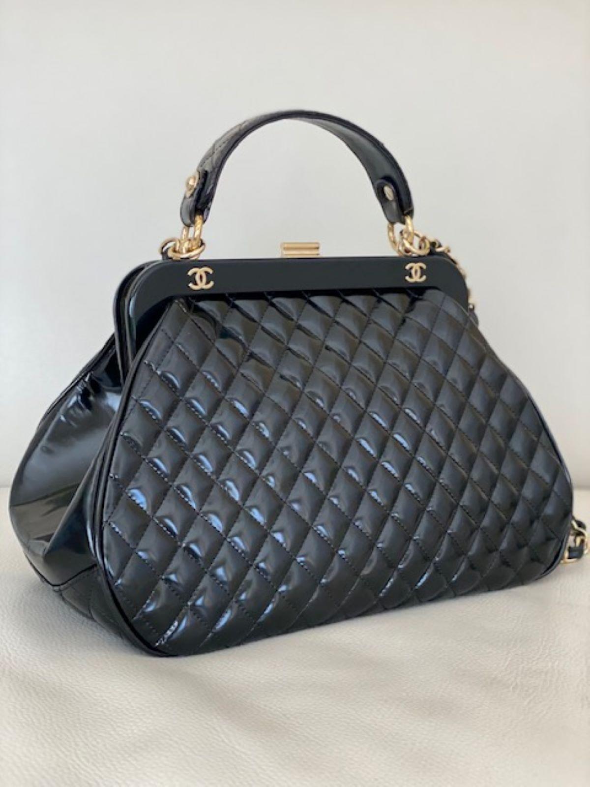 Worn by Kim K. in a larger version

In excellent condition minor wrinkles to patent leather on bottom of bag. Can be worn as a wrist satchel, top handle bag or as a shoulder bag using the chain.

Breathtaking classic piece with gold hardware