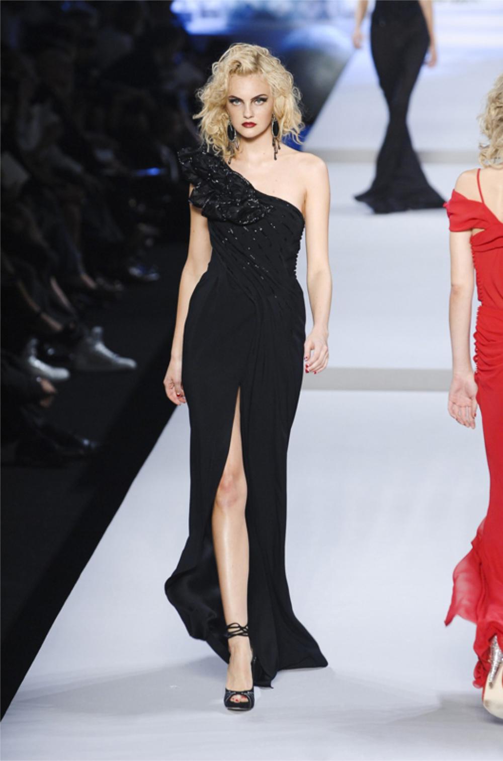An incredibly chic and well-documented Christian Dior black beaded calla lilies one-shoulder silk bias cut gown. This highly coveted Christian Dior treasure from John Galliano's 2008 spring-summer collection is a perfect example of his genius. Vogue