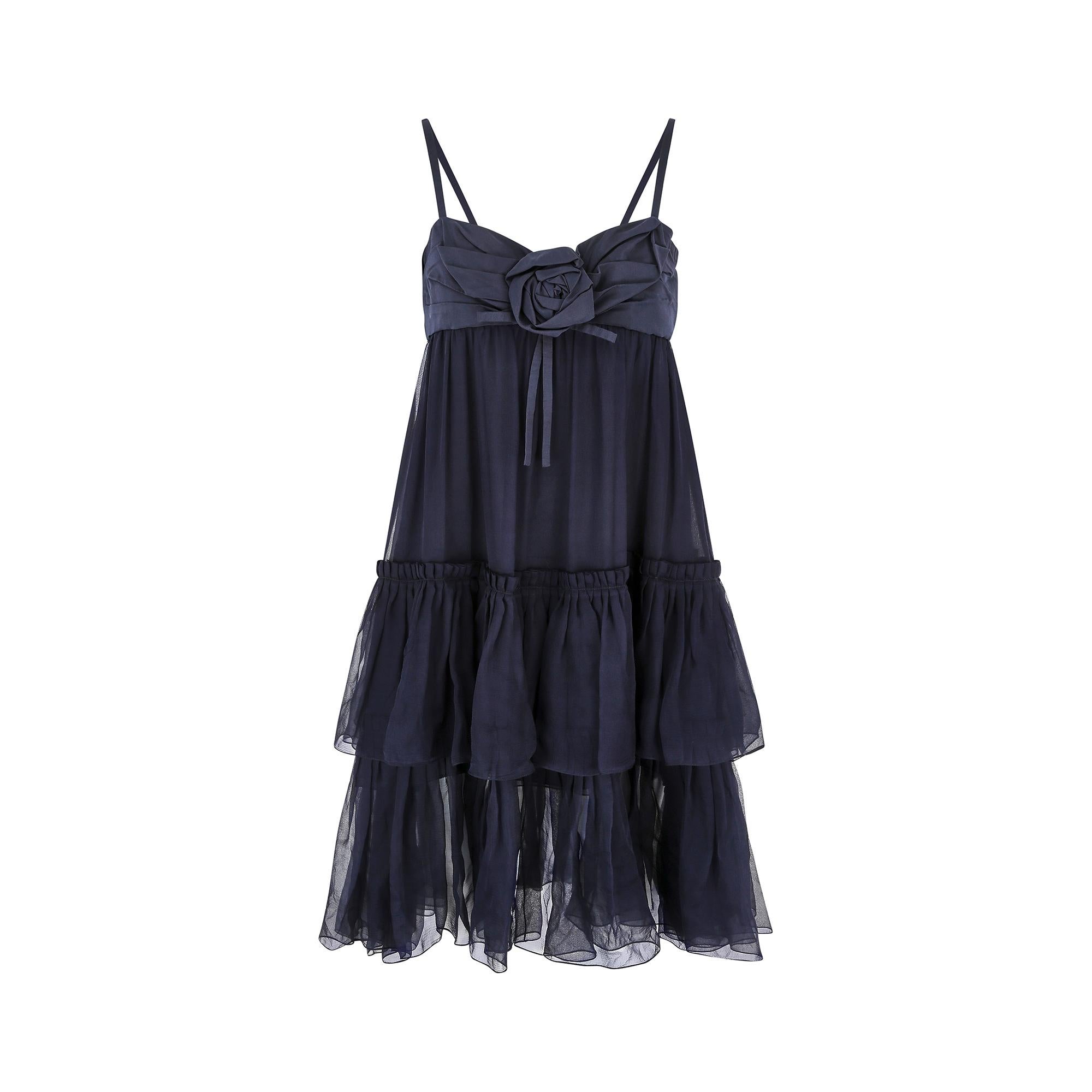 2008 autumn winter collection babydoll dress by Christian Dior, crafted in a delicate deep navy blue chiffon silk. It features a pleated silk bodice with thin shoulder straps, a sweetheart neckline and central rose detail. The rear of the dress