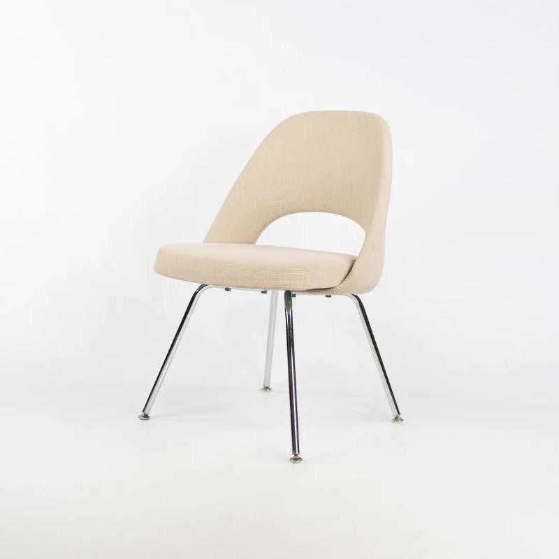 Listed for sale is a single (multiple chairs are available, though the price listed is for each chair) Eero Saarinen for Knoll armless executive chair with tubular steel legs. The chairs are fully upholstered in a light tan or off-white fabric,