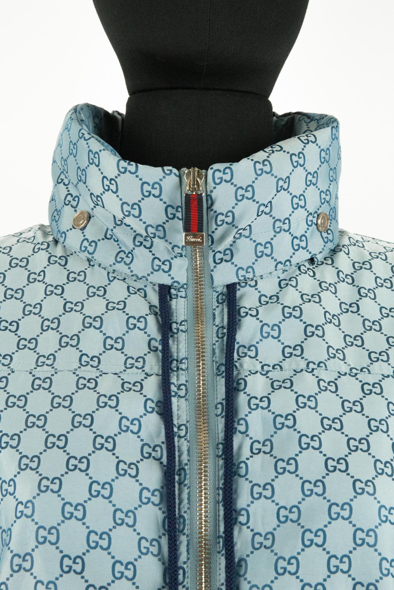 A 2008 Gucci zip-up jacket with a hood. This jacket features an all-over monogram, elasticated waistband, cuffs and toggles in black with silver cuffs to adjust the hood. At the front are two pockets at either side of the zip. The Zip toggle is