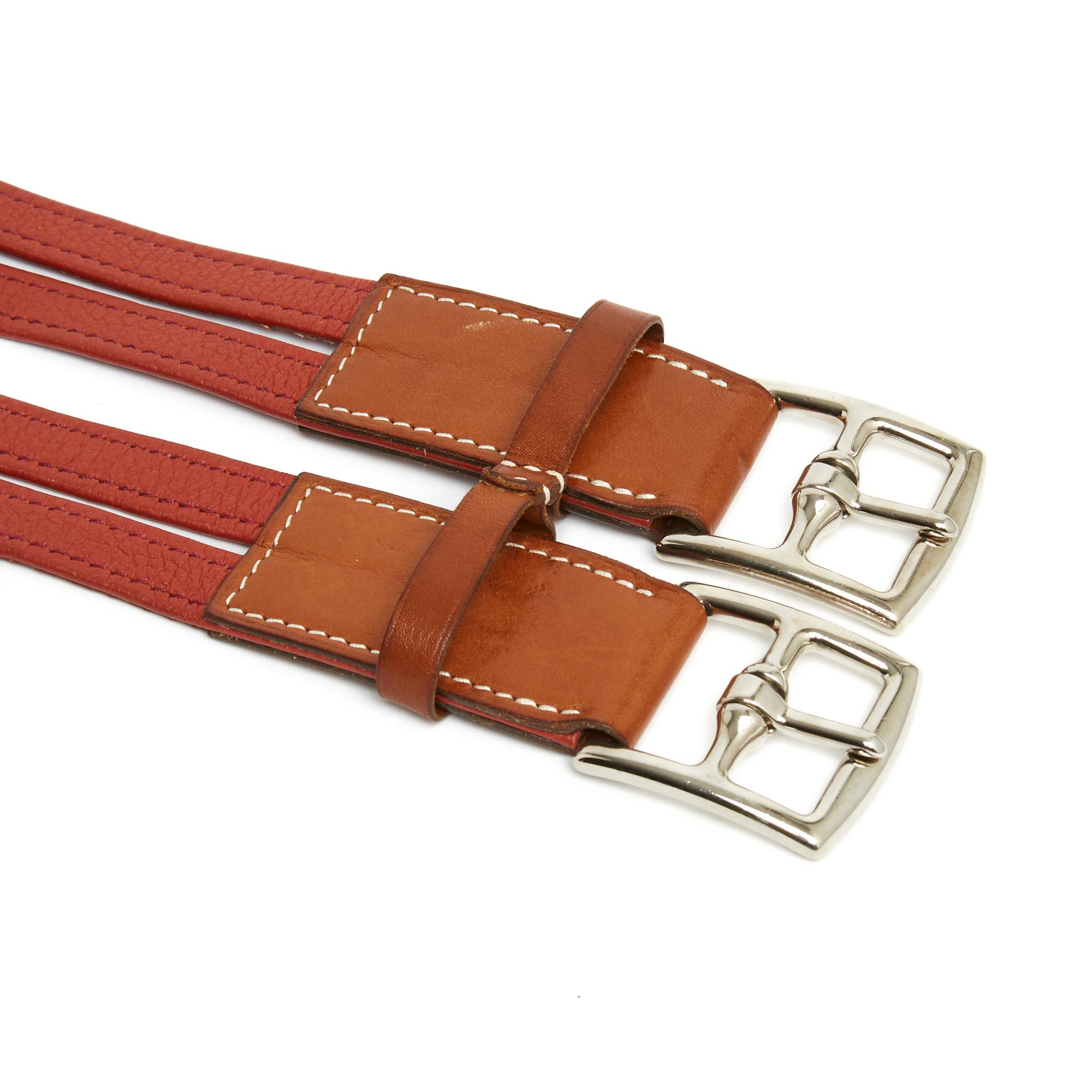 Hermès belt, double Etrivière model, in terracotta red grained leather and natural leather, silver metal buckles (palladium). of the belt 7.75 cm. The belt comes from private sales and it has been worn but it remains in very good condition,