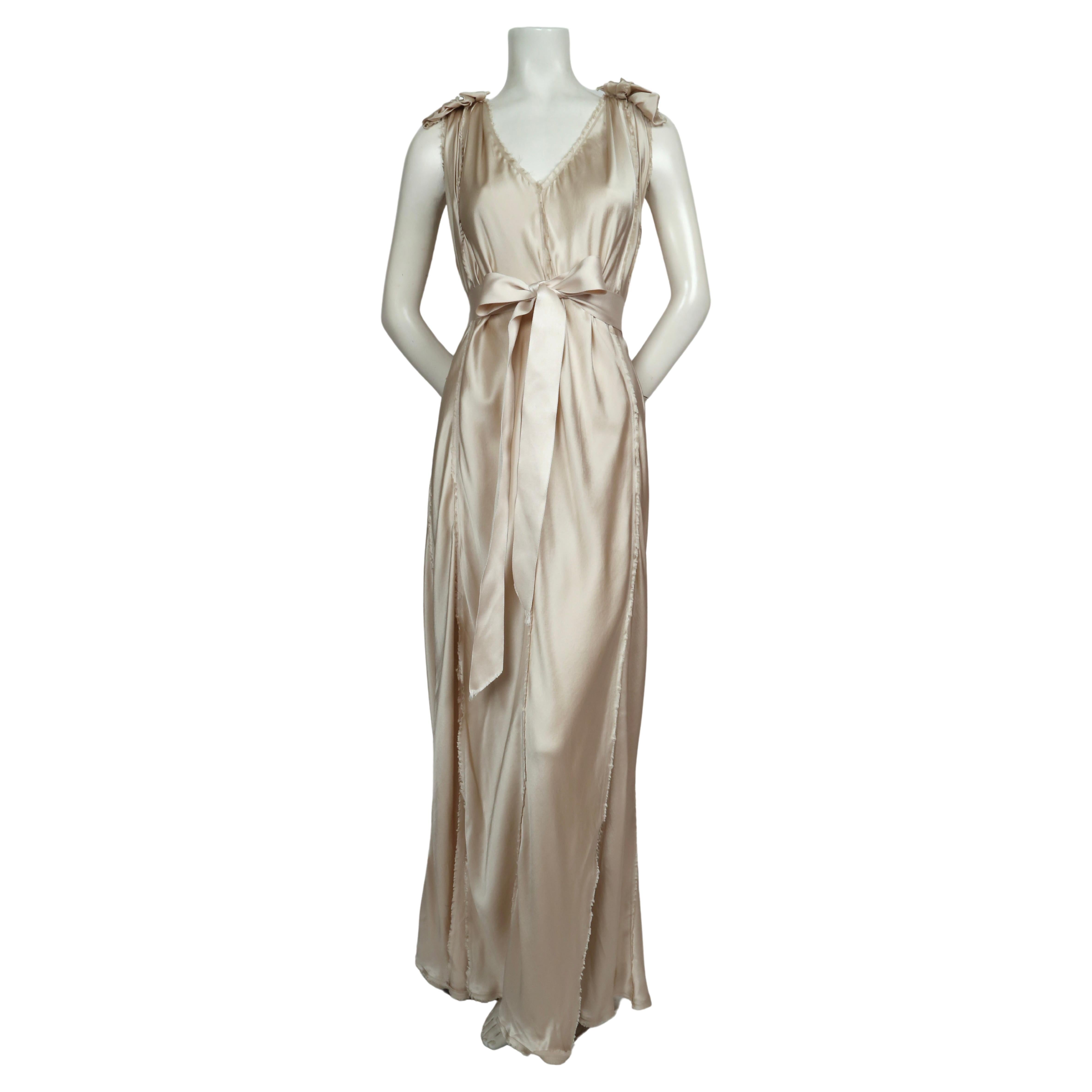 Champagne silk Grecian style wedding  gown designed by Alber Elbaz for Lanvin dating to 2008. French size 36 however there is some flexibility in sizing due to the bias cut of the panels.  Intentionally frayed edges. Net detail at top of shoulders.