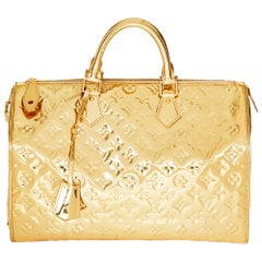 2008 Louis Vuitton Gold Monogram Miroir Vinyl Speedy 35