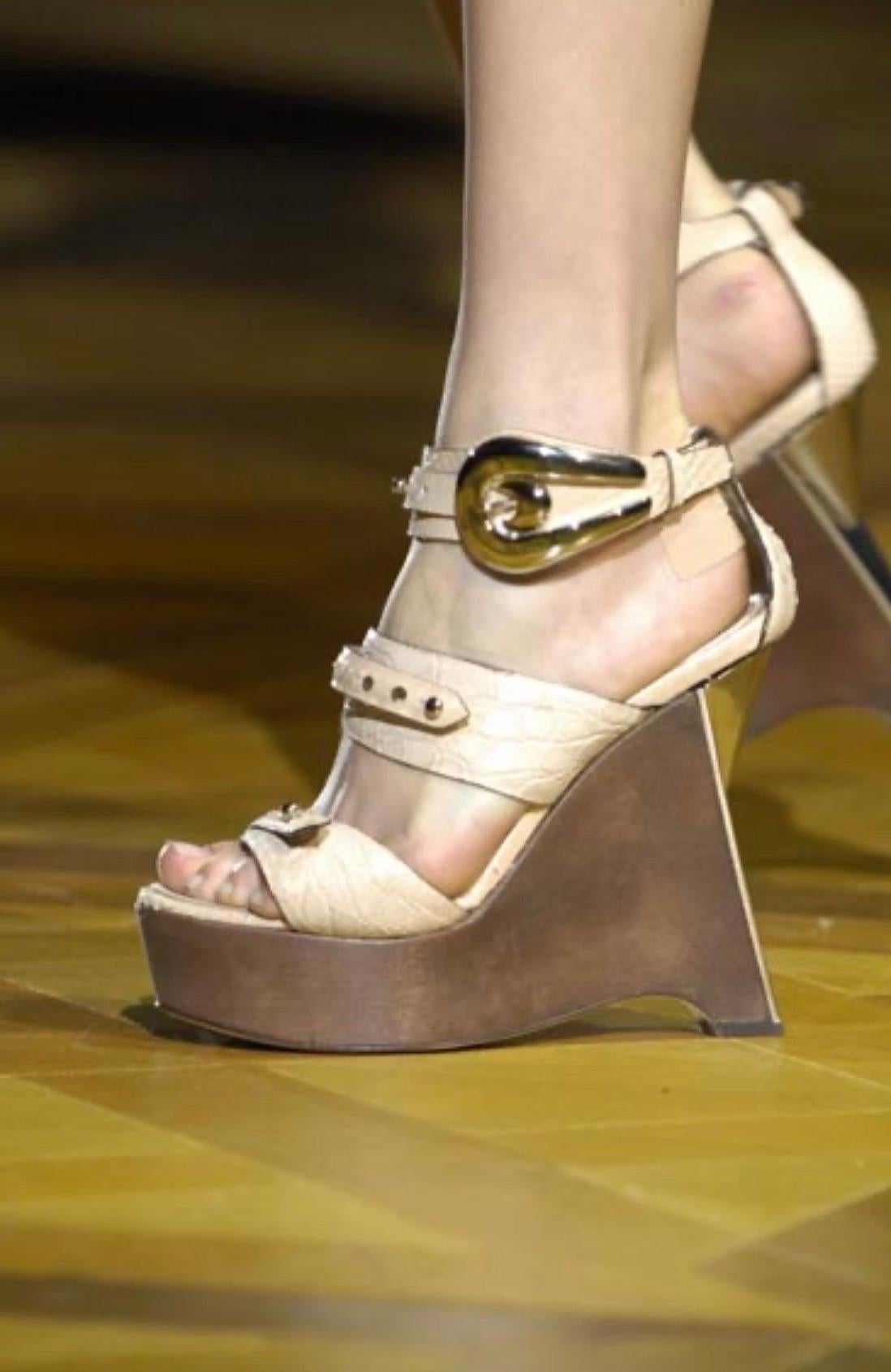 BRAND NEW 2008 ROBERTO CAVALLI SHOES
Celebrate glamorous times with ROBERTO CAVALLI's chic, high-heeled platforms as seen on Kate Moss.
Color: Nude
Material: Snakeskin and crocodile
Embellished with silver tone buckle
Heel measures 5 1/2
