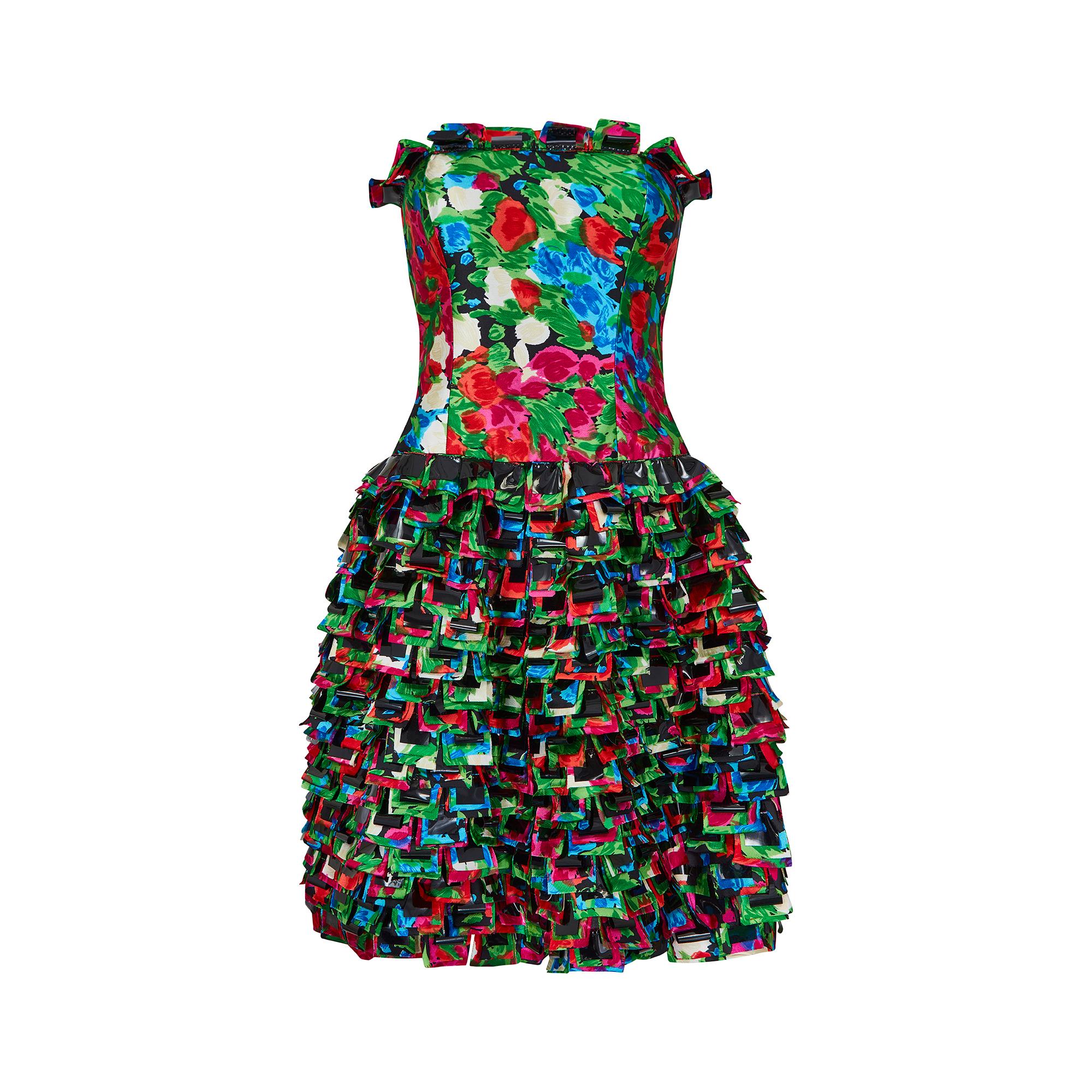 This playful, runway documented dress is by Oscar de la Renta, from the Pre Fall 2008 collection. The dress is constructed with a brightly printed silk, featuring red, pink, green, blue and white flowers in a striking, almost abstract design. The