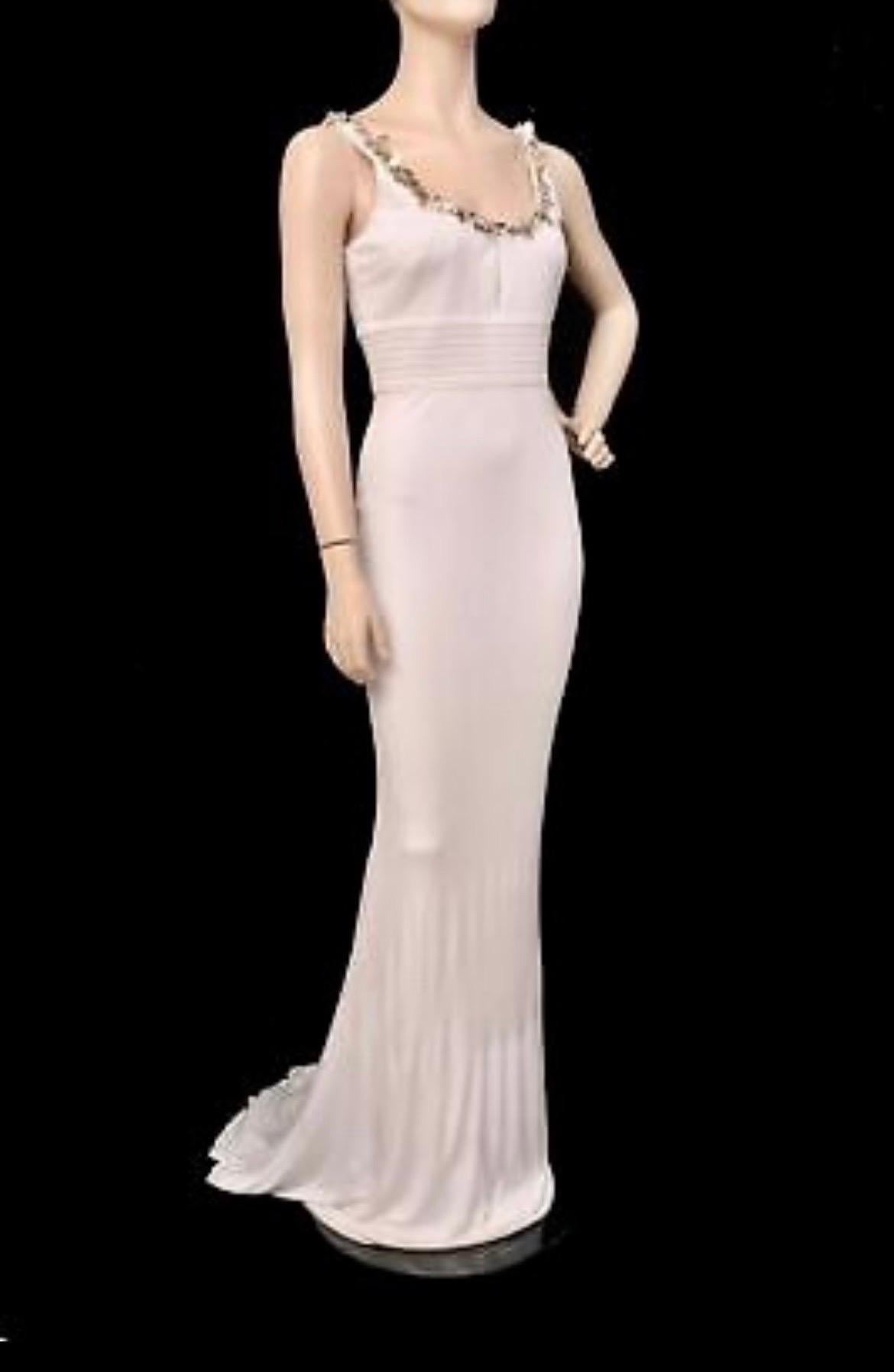  2008 VERSACE DRESS
Precision tailoring and streamlined silhouettes have made Versace a red carpet favorite. 
This gorgeous white dress is cut from lightweight crepe and finished with exquisite crystals and paillettes.
Content: 99% Viscose, 1%