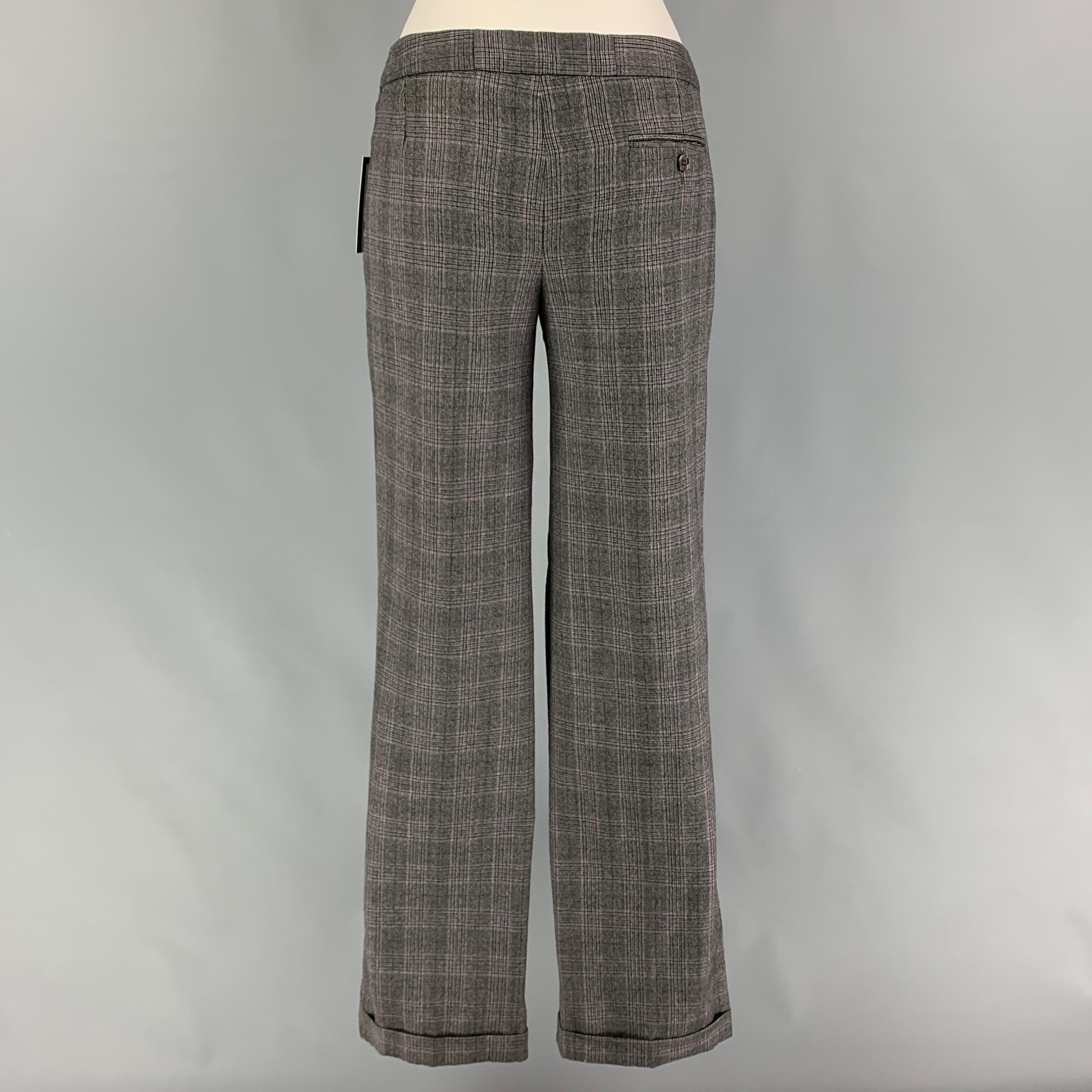 2009 by ALEXANDER McQUEEN dress pants comes in a grey virgin wool featuring a flat front, cuffed leg, and a zip fly closure. Made in Italy. 

Very Good Pre-Owned Condition. Pants have been professionally altered. Small mark at back left leg.