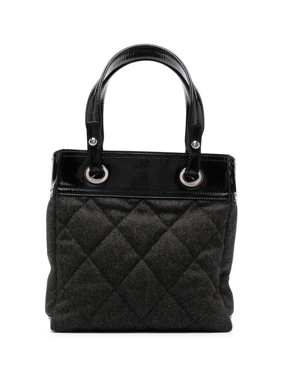 Chanel by Karl Lagerfeld grey wool “Paris-Biarritz” tote bag featuring a diamond quilted pattern, black patent leather details, leather handles, a top zip opening, silver-tone hardware, an inside pocket.
Delivered with his authenticity card.
Circa