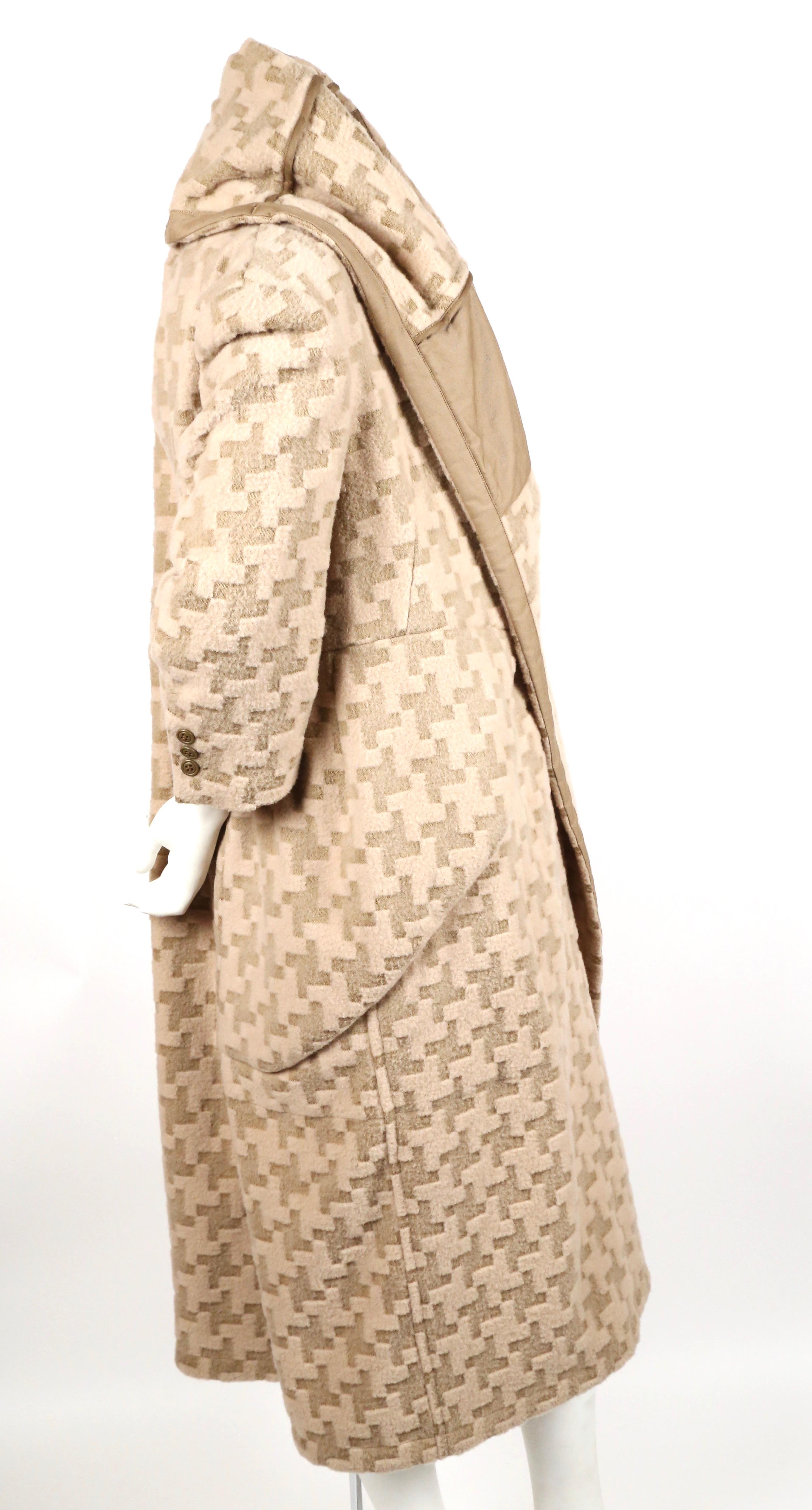 Incredible cream and brown woven houndstooth draped wool coat from Comme Des Garcons. Appears as a coat worn over another coat in a classic 'visual pun' form from CDG. Exact coat as seen on runway. Can be worn numerous ways. Labeled a size 'M'