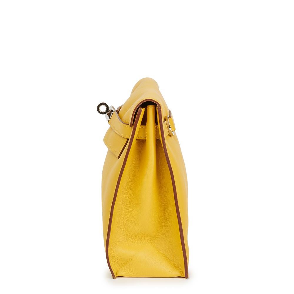 HERMÈS
Jaune d'or Swift Leather Kelly Danse

Reference: HB2282
Serial Number: [M]
Age (Circa): 2009
Accompanied By: Hermès Dust Bag, Box 
Authenticity Details: Date Stamp (Made in France)
Gender: Ladies
Type: Shoulder, Crossbody, Backpack, Belt