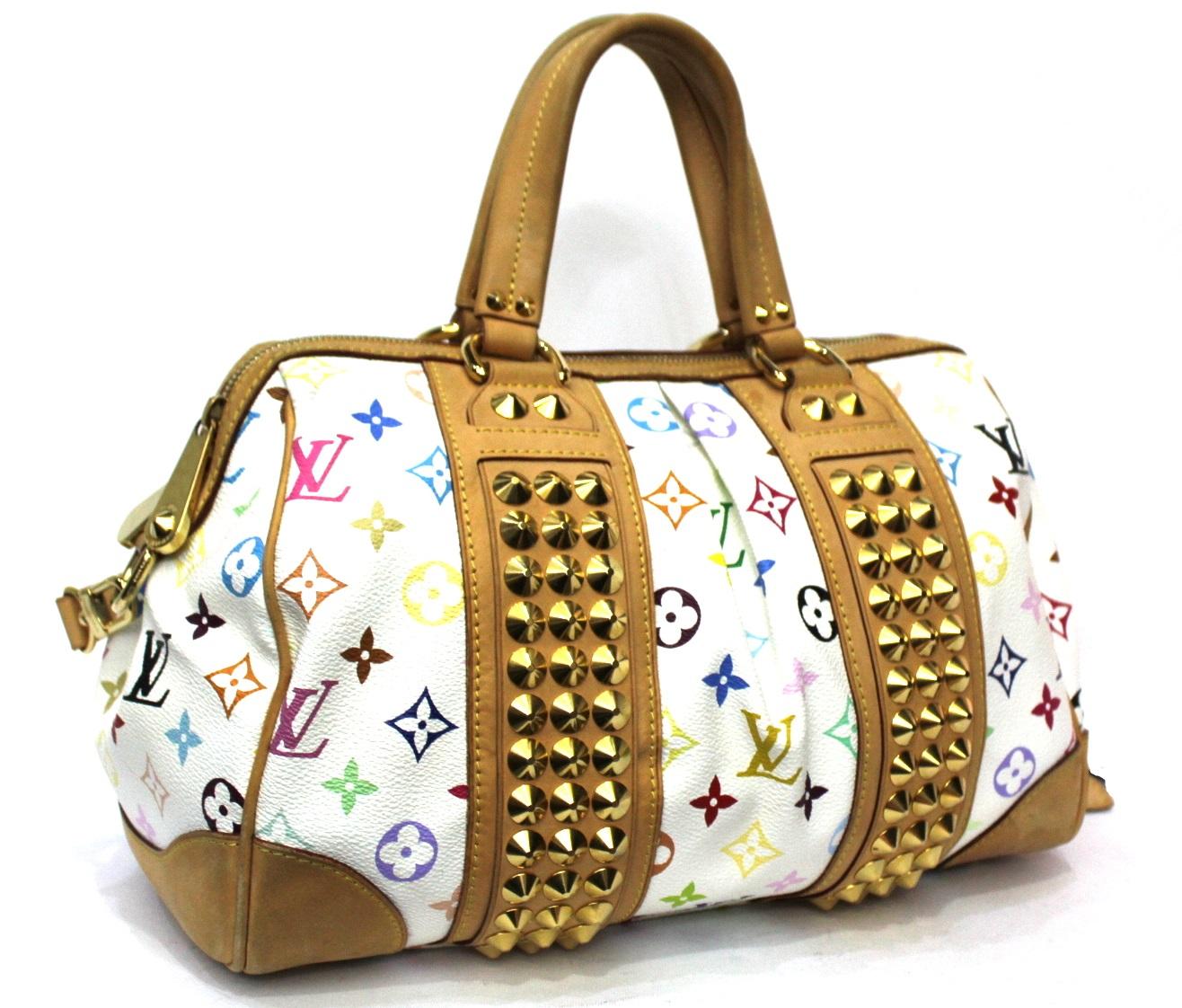 Louis Vuitton multicolor pattern Courtney model. Enriched with golden studs and hardware.
Equipped with double handle and removable cowhide shoulder strap.
Zip closure, internally very large.
It is in excellent condition, year 2009.